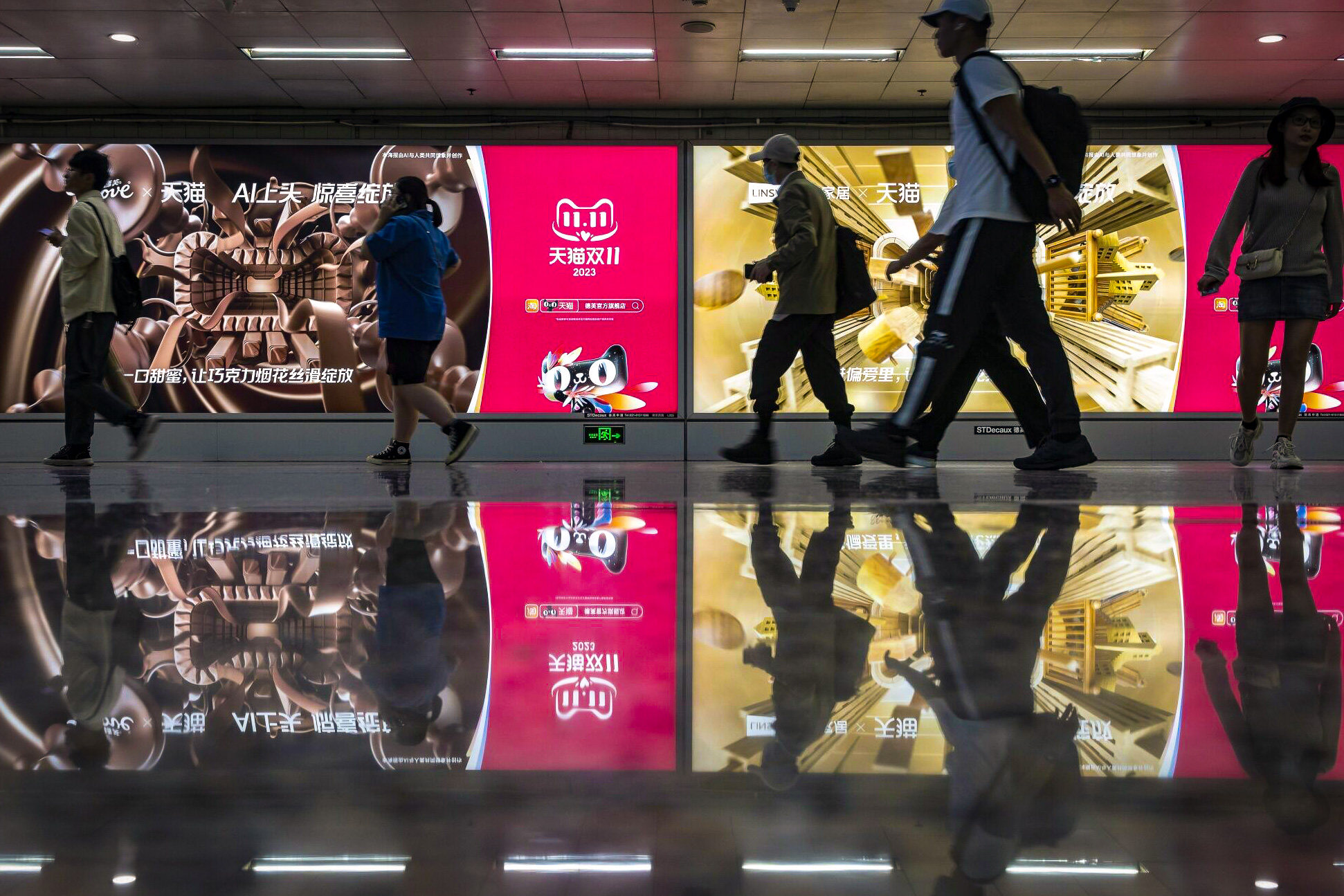 An advertisement for the Singles’ Day shopping event on Alibaba Group Holding Ltd.’s Tmall e-commerce platform at a subway station in Shanghai, China, on Saturday, Nov. 4, 2023. Alibaba and Tencent Holdings Ltd. would team up in the upcoming Singles’ Day shopping festival, Alibaba’s signature annual event that dwarfs Black Friday in size and growth. Photo: Bloomberg