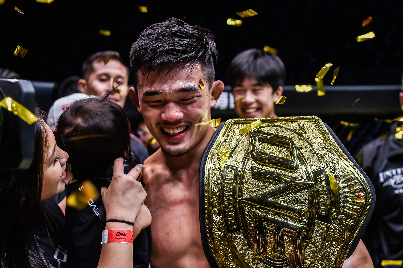 Christian Lee celebrates with his wife and daughter after reclaiming the ONE lightweight MMA title with a TKO of Ok Rae-yoon in August 2022. Photos: ONE Championship