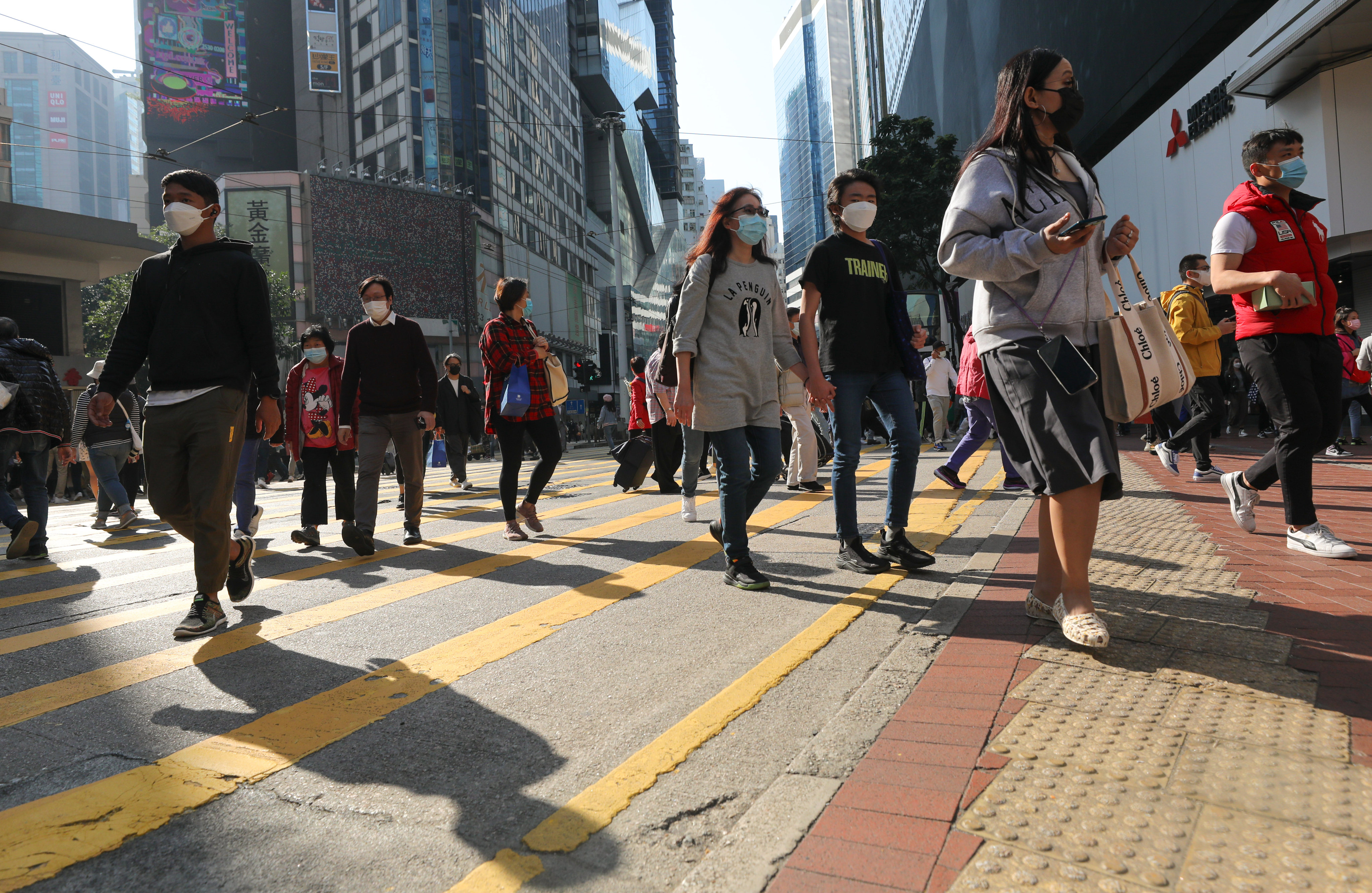 People walk in Causeway Bay, Hong Kong, on December 28, 2022. Photo: Xiaomei Chen