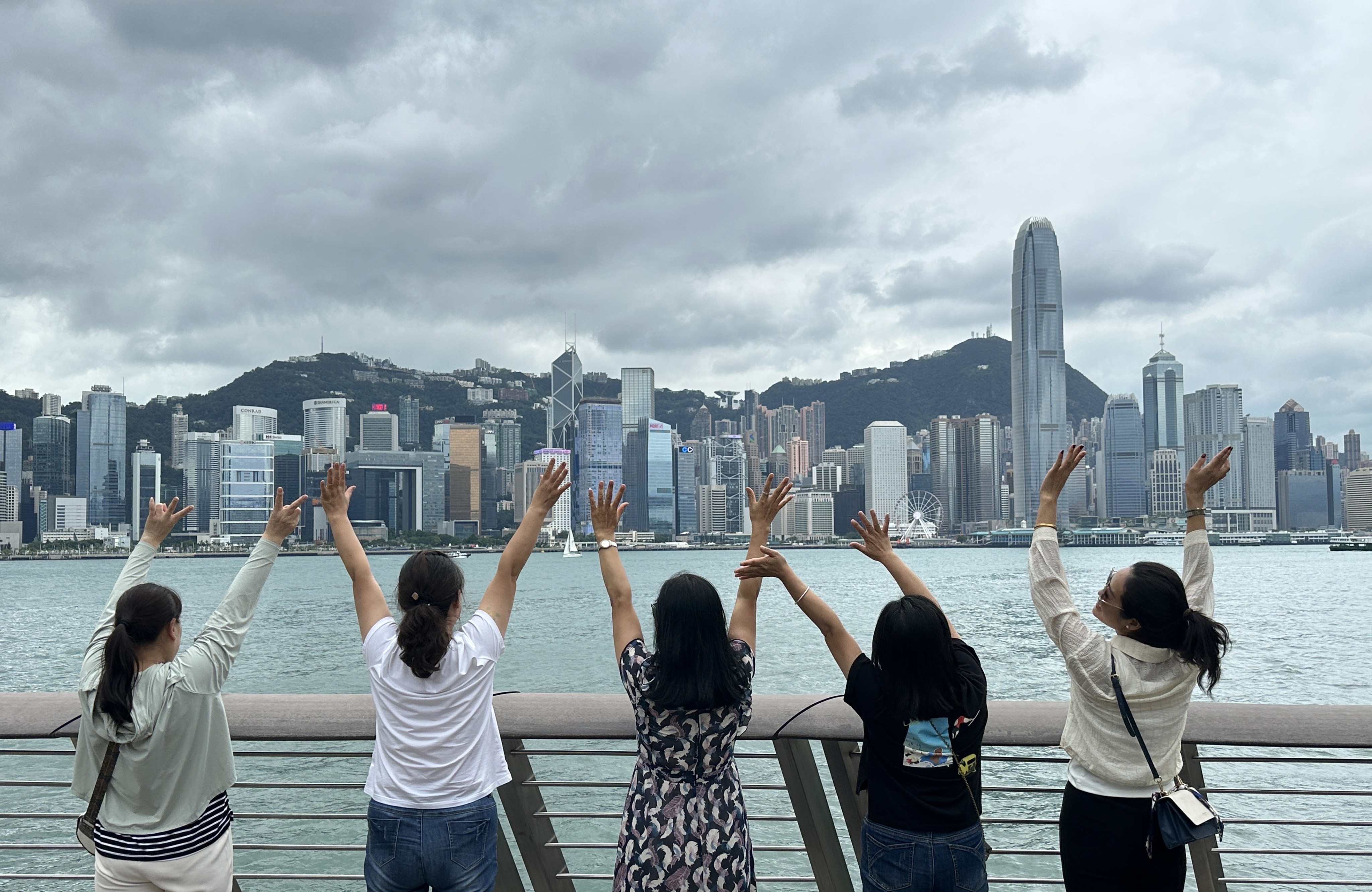 Tourists enjoy the view from the Tsim Sha Tsui waterfront. Photo: Jelly Tse