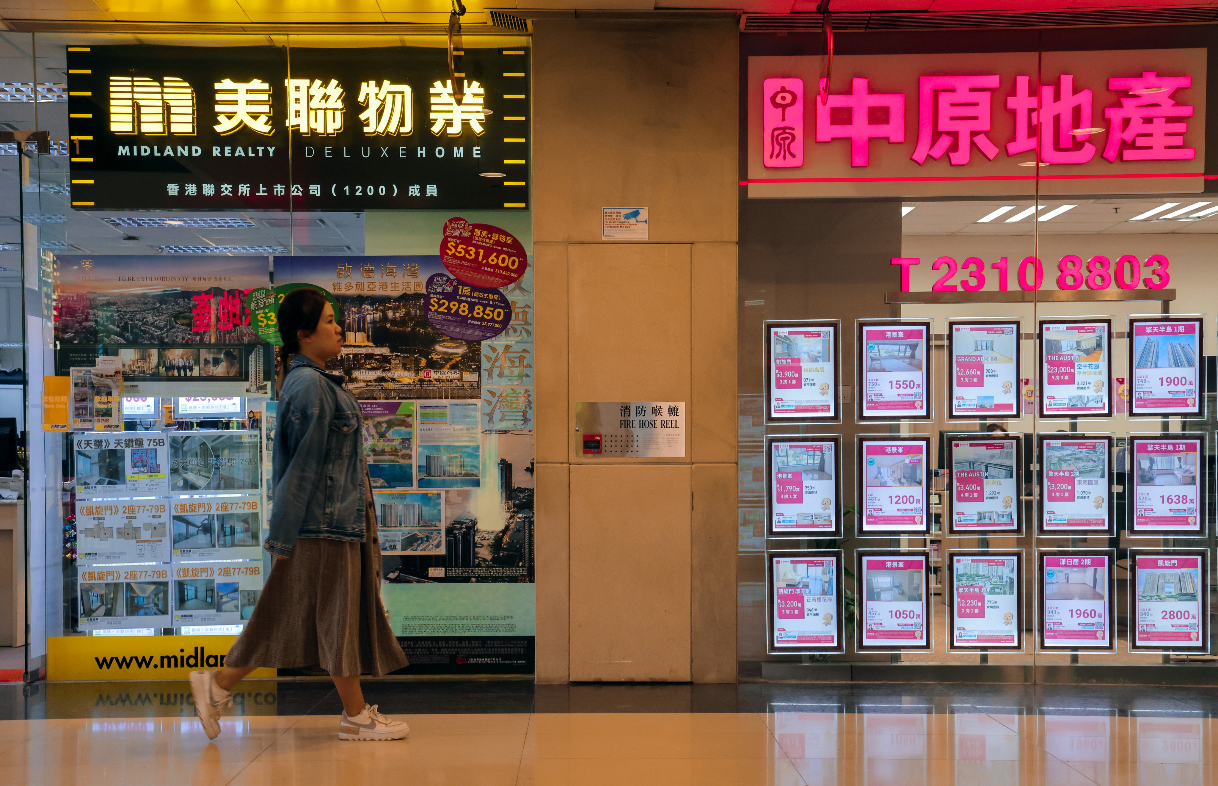 Midland and Centaline outlets in Hong Kong. The two property agency giants control 90 per cent of the market. Photo: Jelly Tse