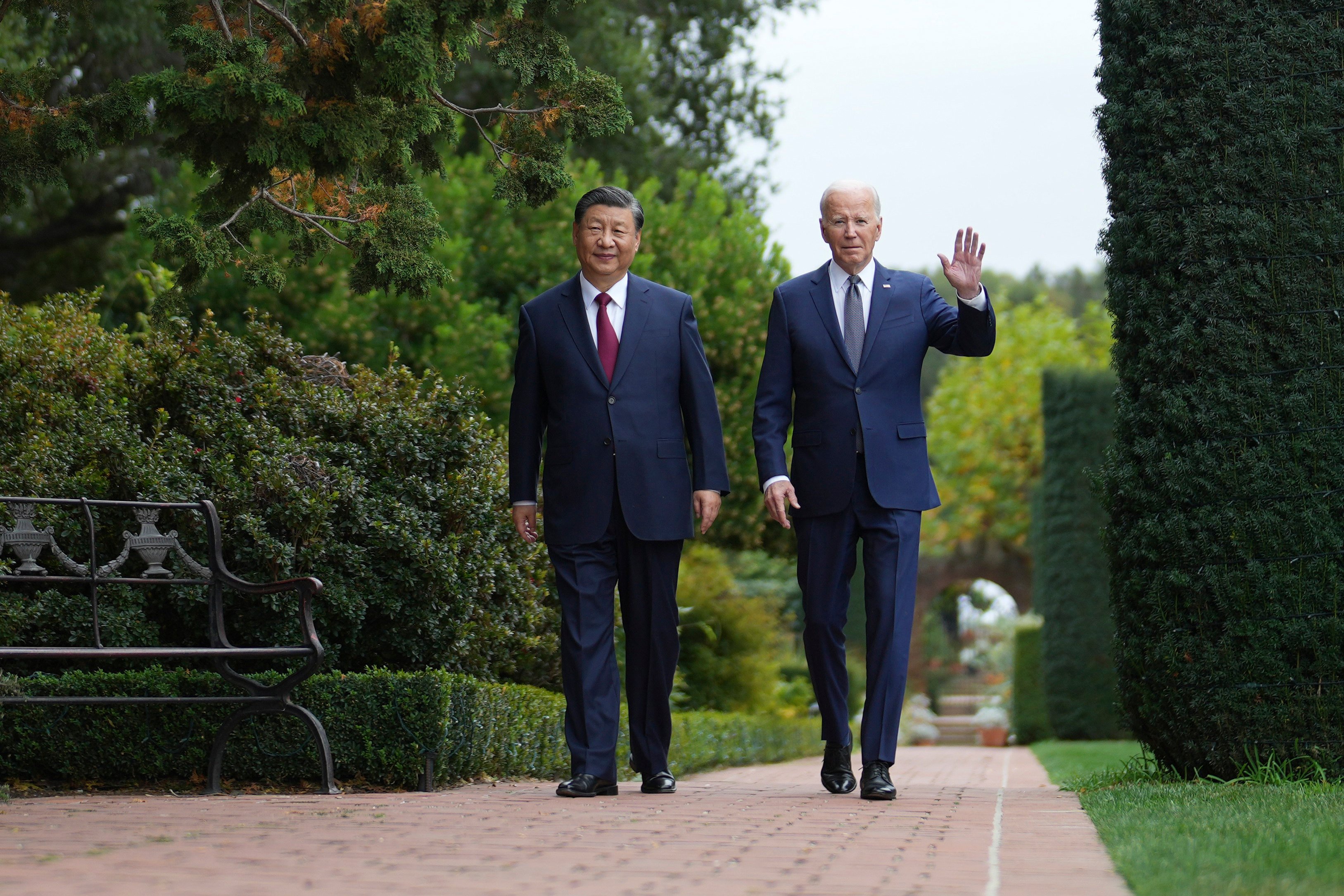 Xi Jinping and Joe Biden walk in the gardens of the Filoli Estate in California. Photo: AP
