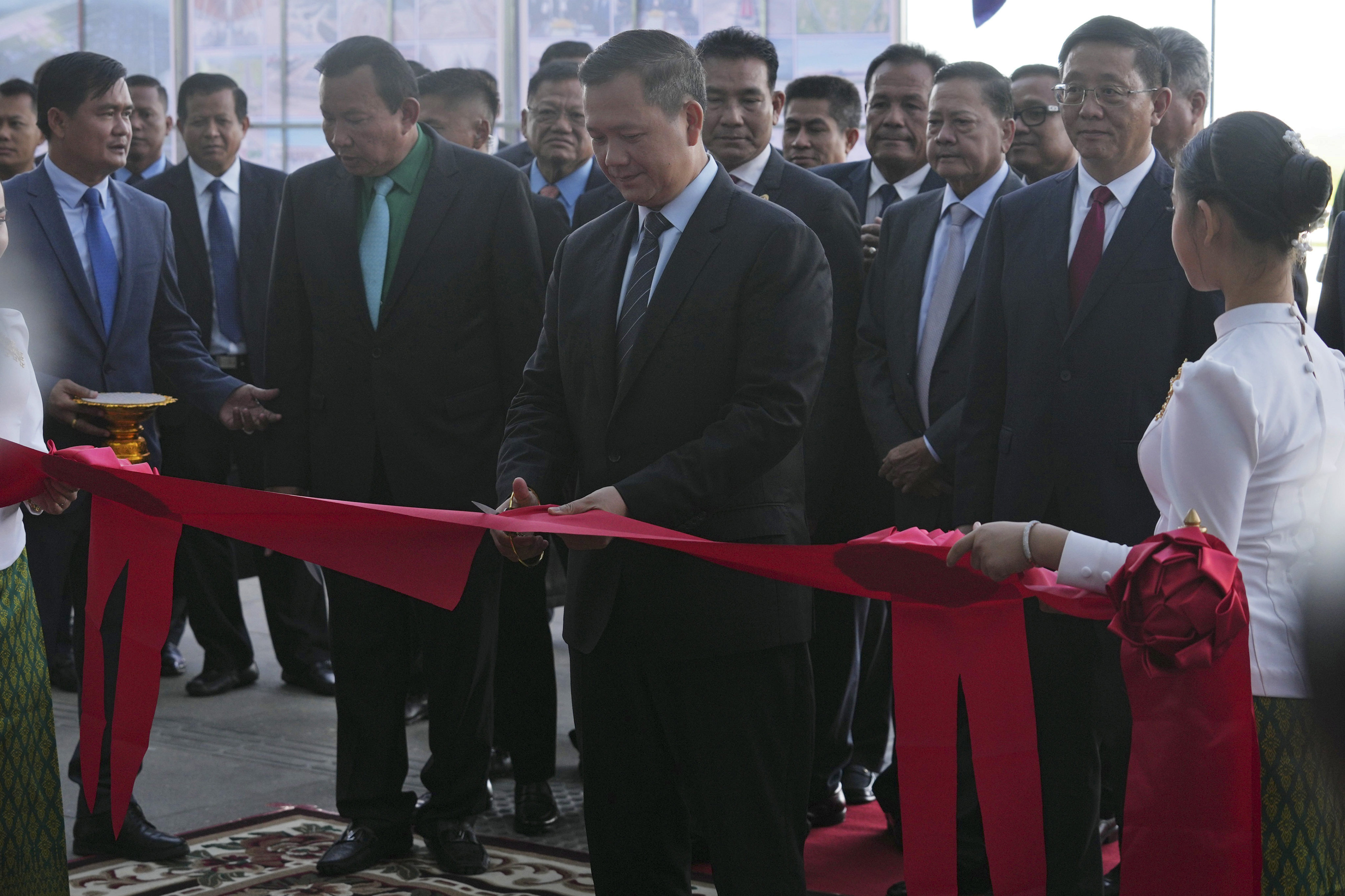 Cambodian Prime Minister Hun Manet cuts the ribbon to inaugurate the Siem Reap-Angkor International Airport, in Cambodia on Thursday. Photo: AP