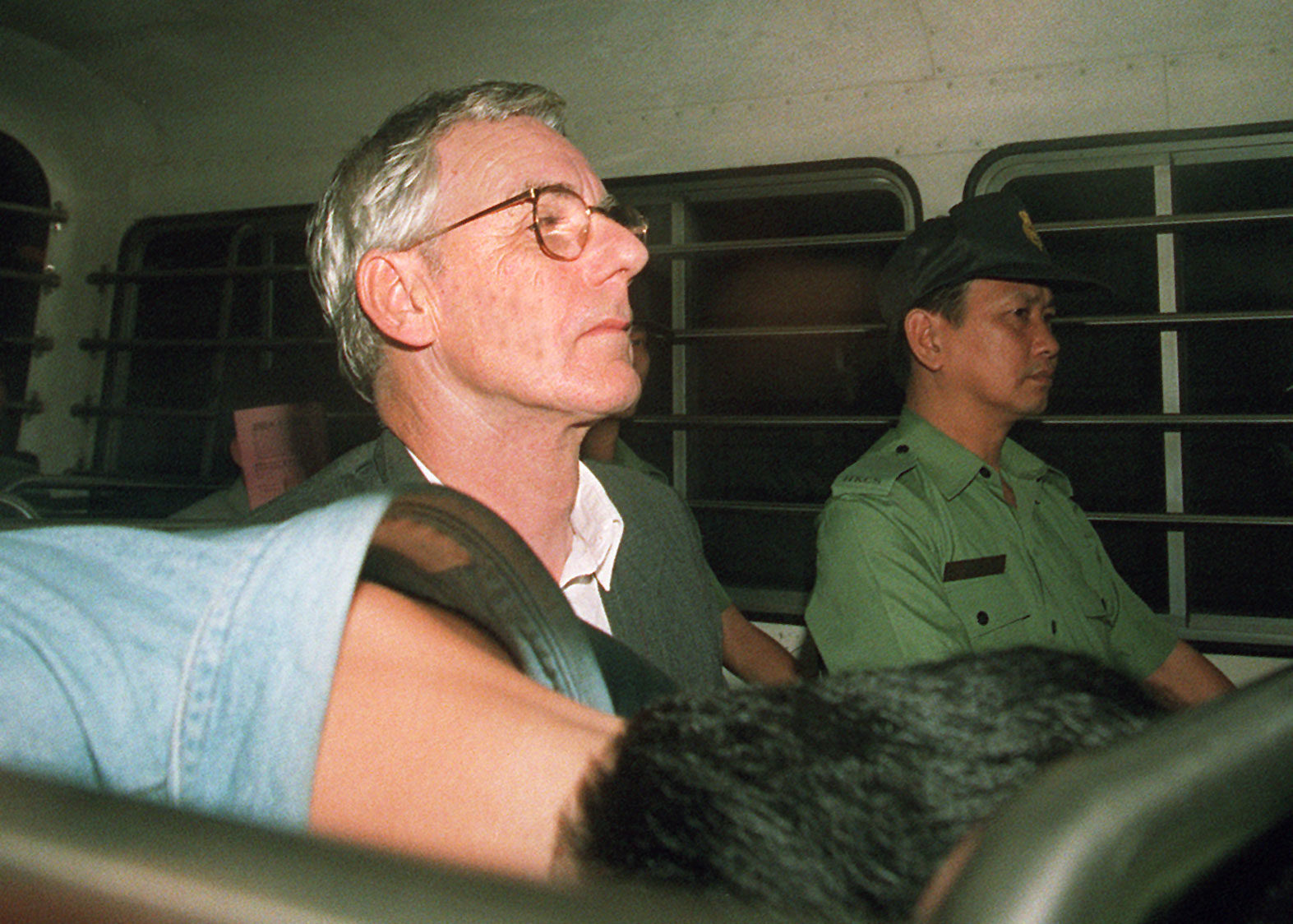 Clive Holgate leaves court in Wan Chai, Hong Kong, in 1995. Accused of living beyond his salary and of taking bribes, the civil servant claimed some of his unexplained money had been left behind when his wife – a heavy gambler who had a secret lover – disappeared. Photo: SCMP