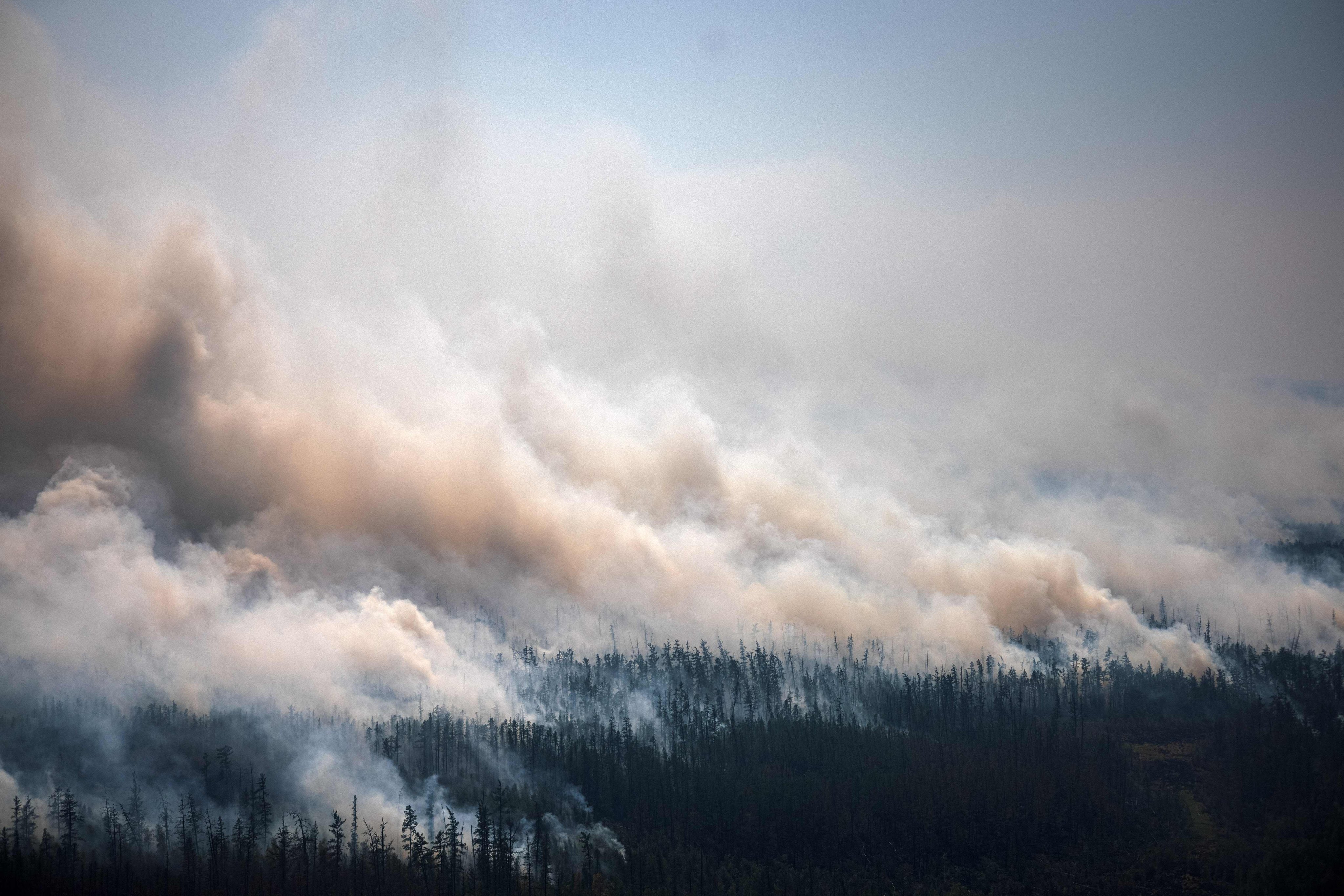 A forest fire in Siberia on July 27, 2021. The spike in wildfires is concentrated in uninhabited boreal forests like this, which store between 30 and 40 per cent of all land-based carbon. Photo: AFP