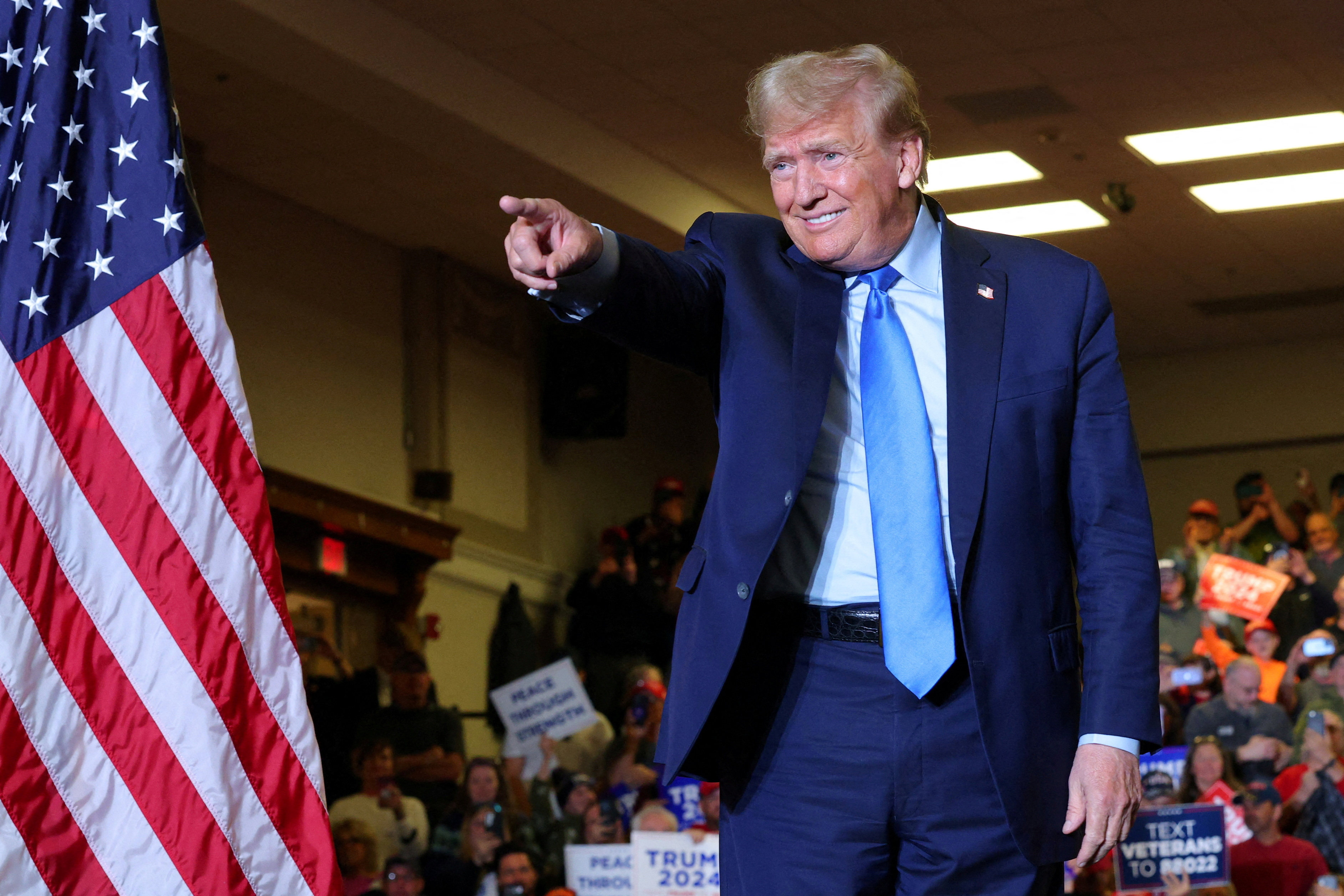 Donald Trump gestures during a campaign rally in Claremont, New Hampshire, on November 11. If a man who is under criminal indictment and who claims he would invoke the Insurrection Act to silence his opponents has a fair chance of being elected president, there is good reason to believe US democracy is in peril. Photo: Reuters