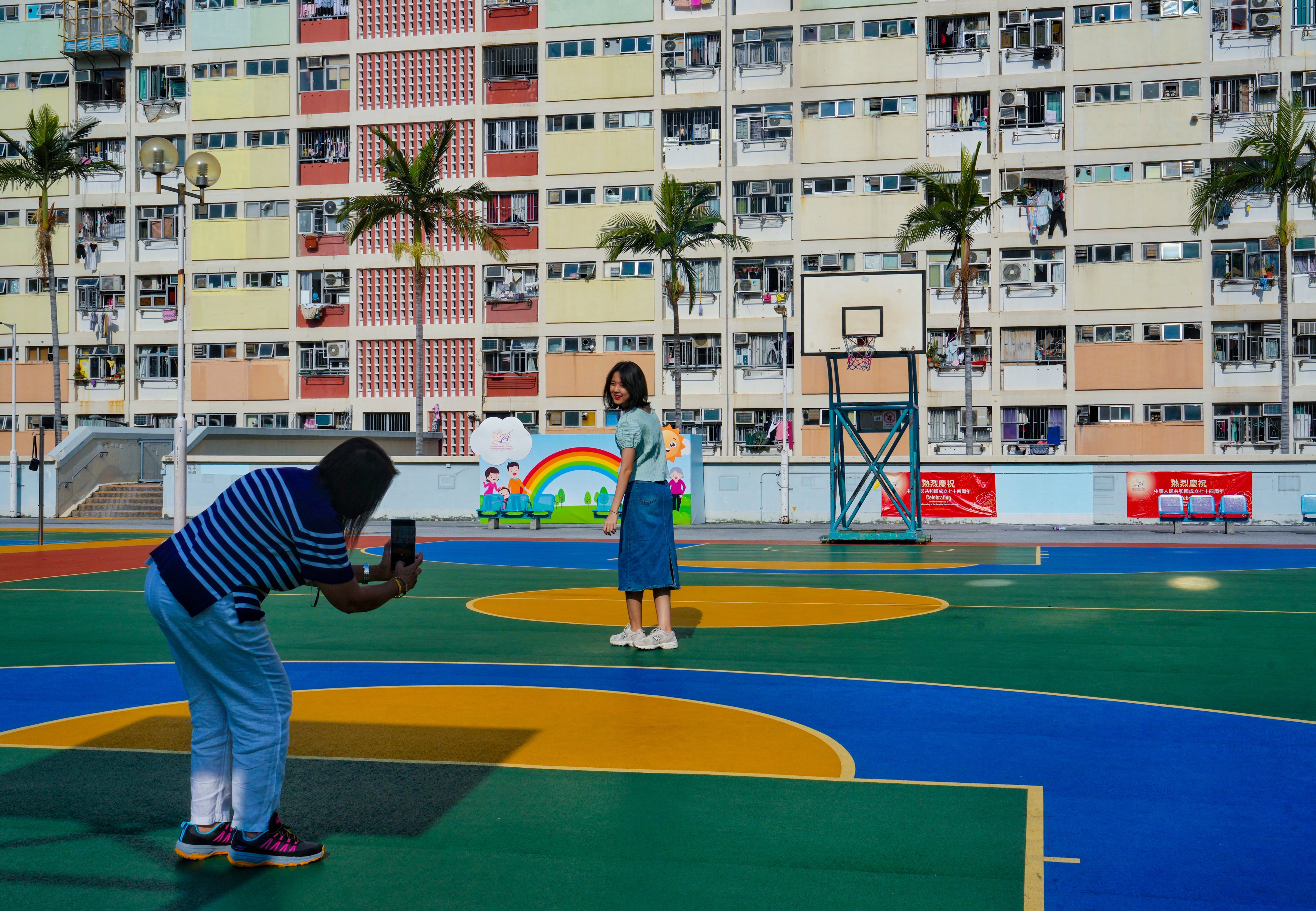 People take photos at Choi Hung Estate on November 6. The Housing Authority reportedly plans to demolish and rebuild the 60-year-old estate that has become a tourist hotspot. Photo: Elson Li