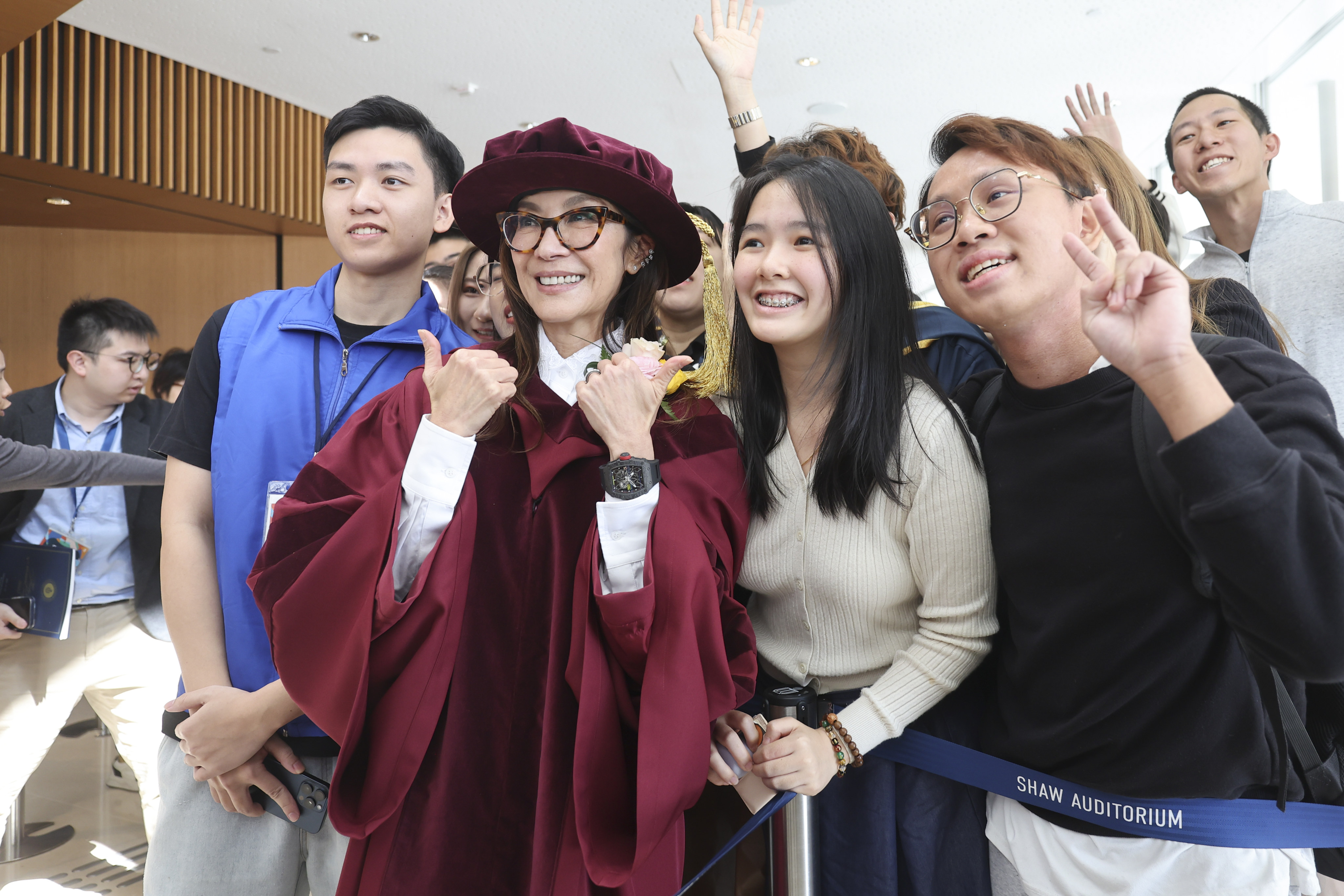 Thumbs up from Michelle Yeoh as she poses for a picture with fans at the Hong Kong University of Science and Technology. Photo: Edmond So