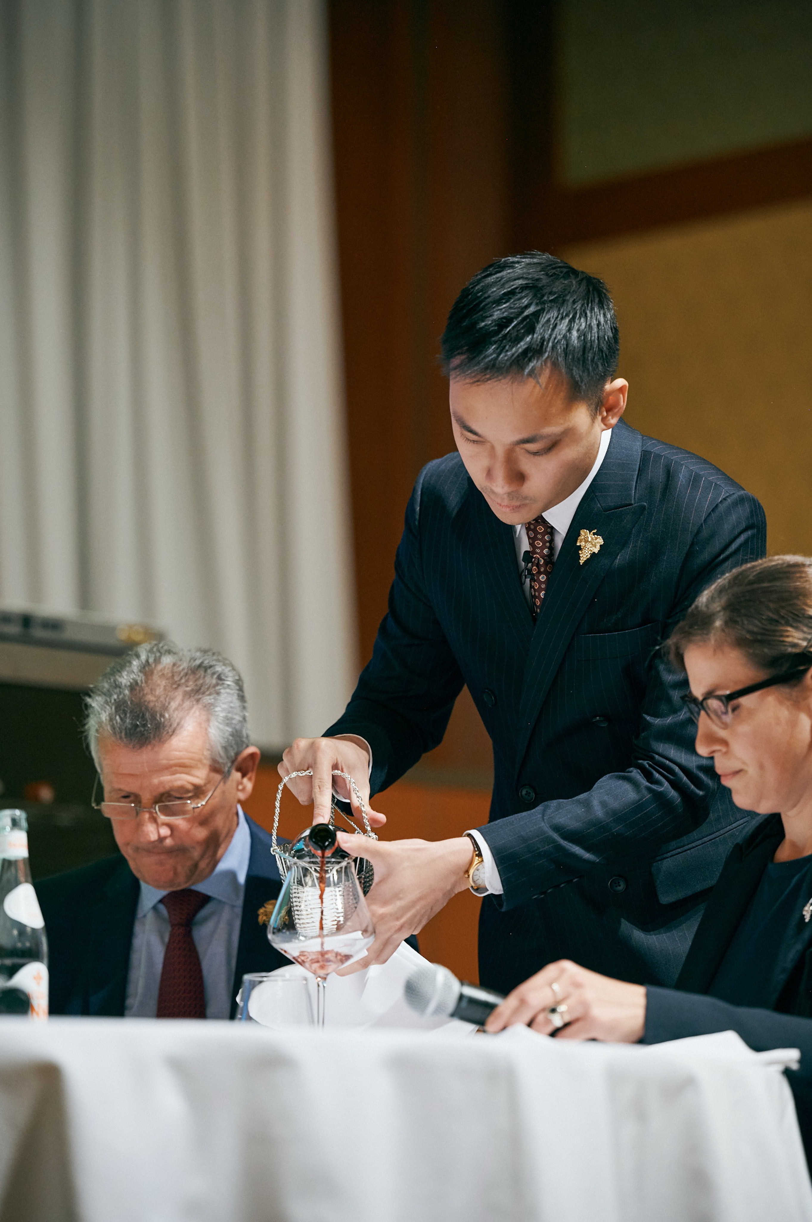 Mason Ng pours wine for judges during the final stage of The Best Sommelier of Asia and Oceania 2022 competition held in Tokyo. Photo: courtesy of Mason Ng