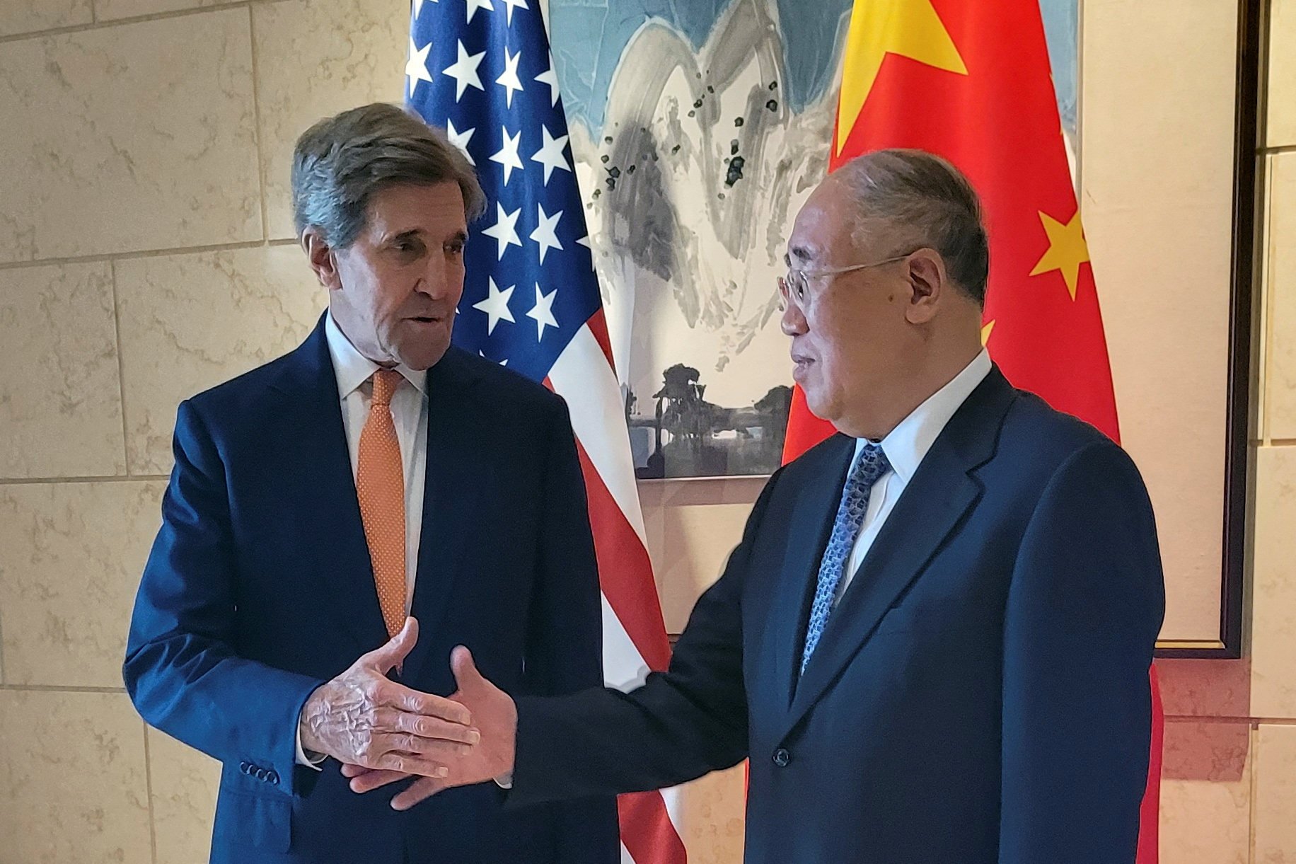 US climate envoy John Kerry shakes hands with his Chinese counterpart Xie Zhenhua before a meeting in Beijing on July 17. Photo: Reuters