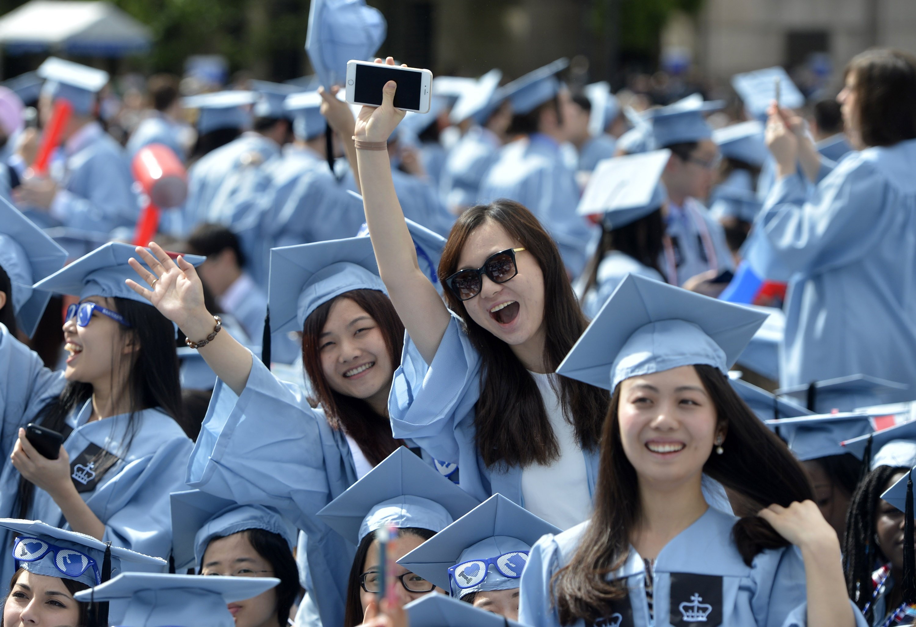 Chinese students at the Ivy League Columbia University in New York celebrate their graduation. Hong Kong ranked 25th in the world for the number of its residents studying in the US. Photo: Xinhua