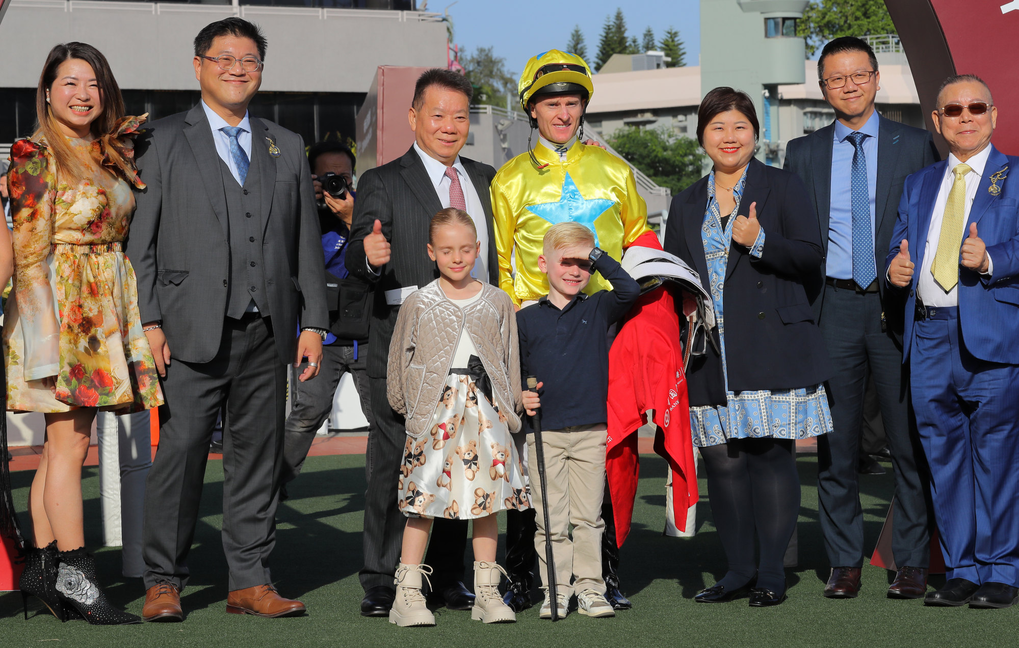 Manfred Man, Zac Purton and his children, and Lucky Sweynesse’s owners celebrate his Jockey Club Sprint win.
