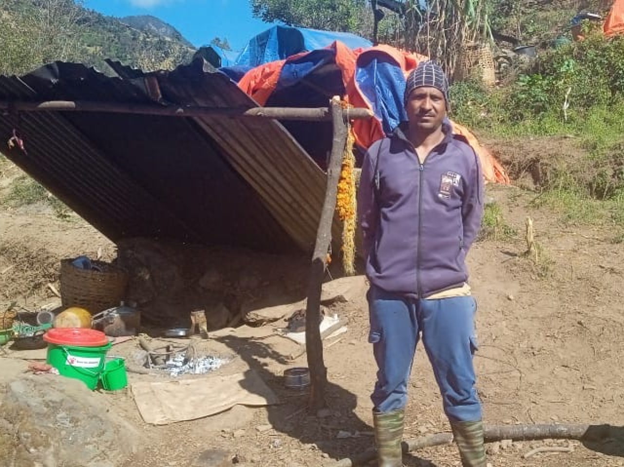 Jaydhan Tamatta, a resident living in Kuse, Jajarkot with his makeshift kitchen following the November 3 earthquake. Photo: courtesy of Jaydhan Tamatta
