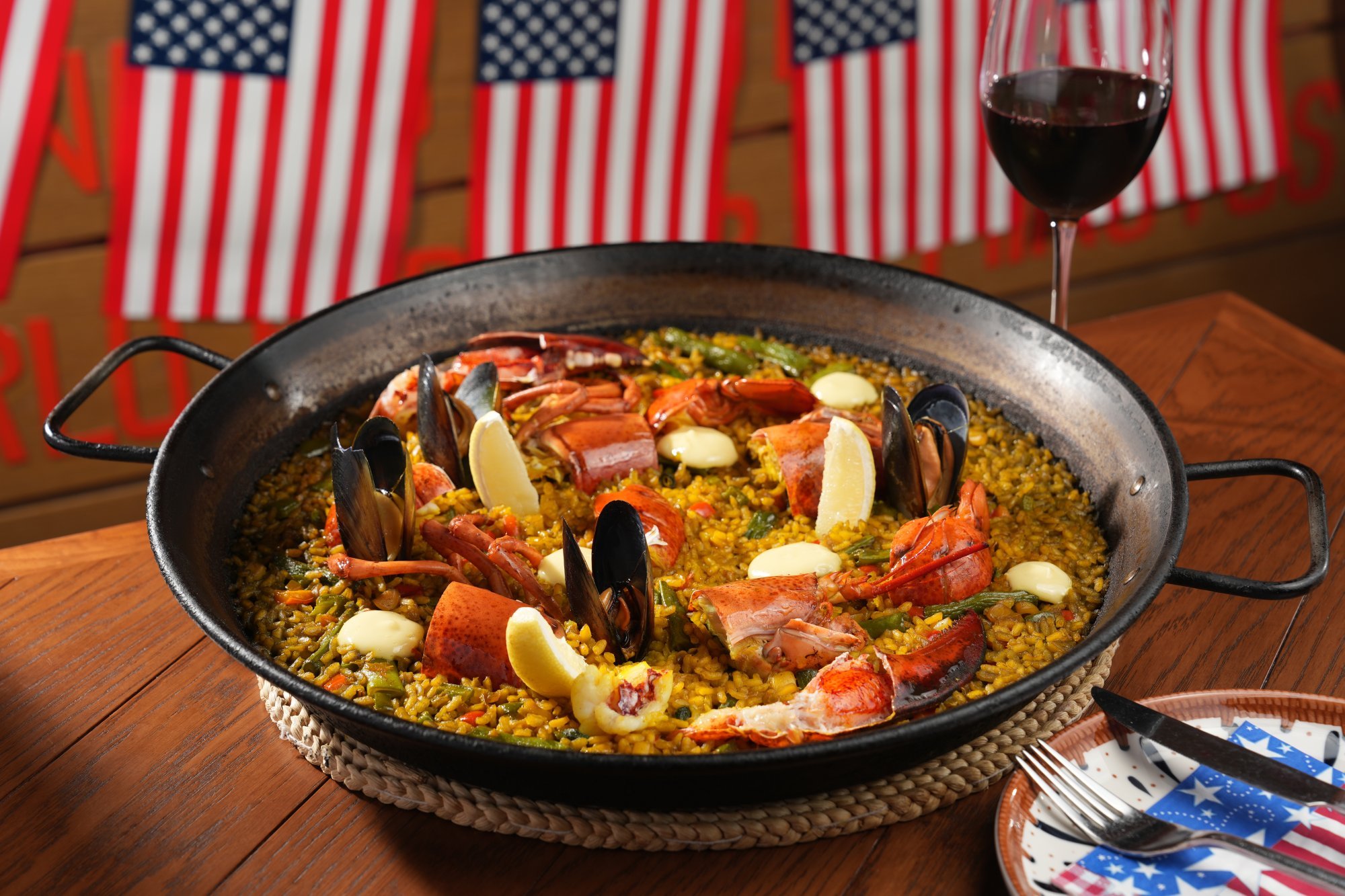 The lobster paella from La Paloma is prepared with US- raised Boston lobster, as well as mussels and green beans. Photo: La Paloma