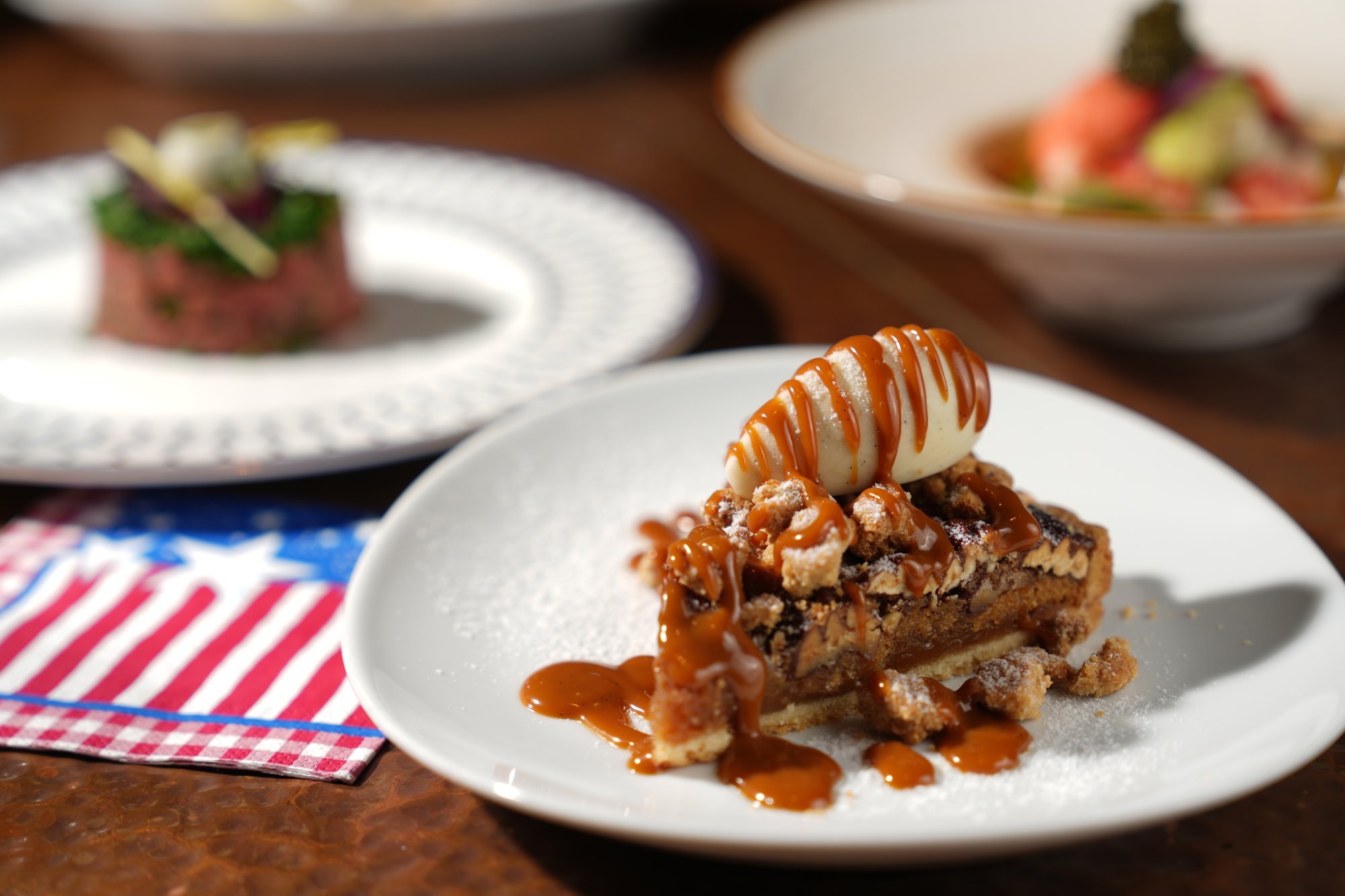 As part of its Delicious USA menu, Grand Hyatt Steakhouse is serving a nostalgic seasonal dessert – pecan pie with caramel sauce and ice cream. Photo: Grand Hyatt Steakhouse
