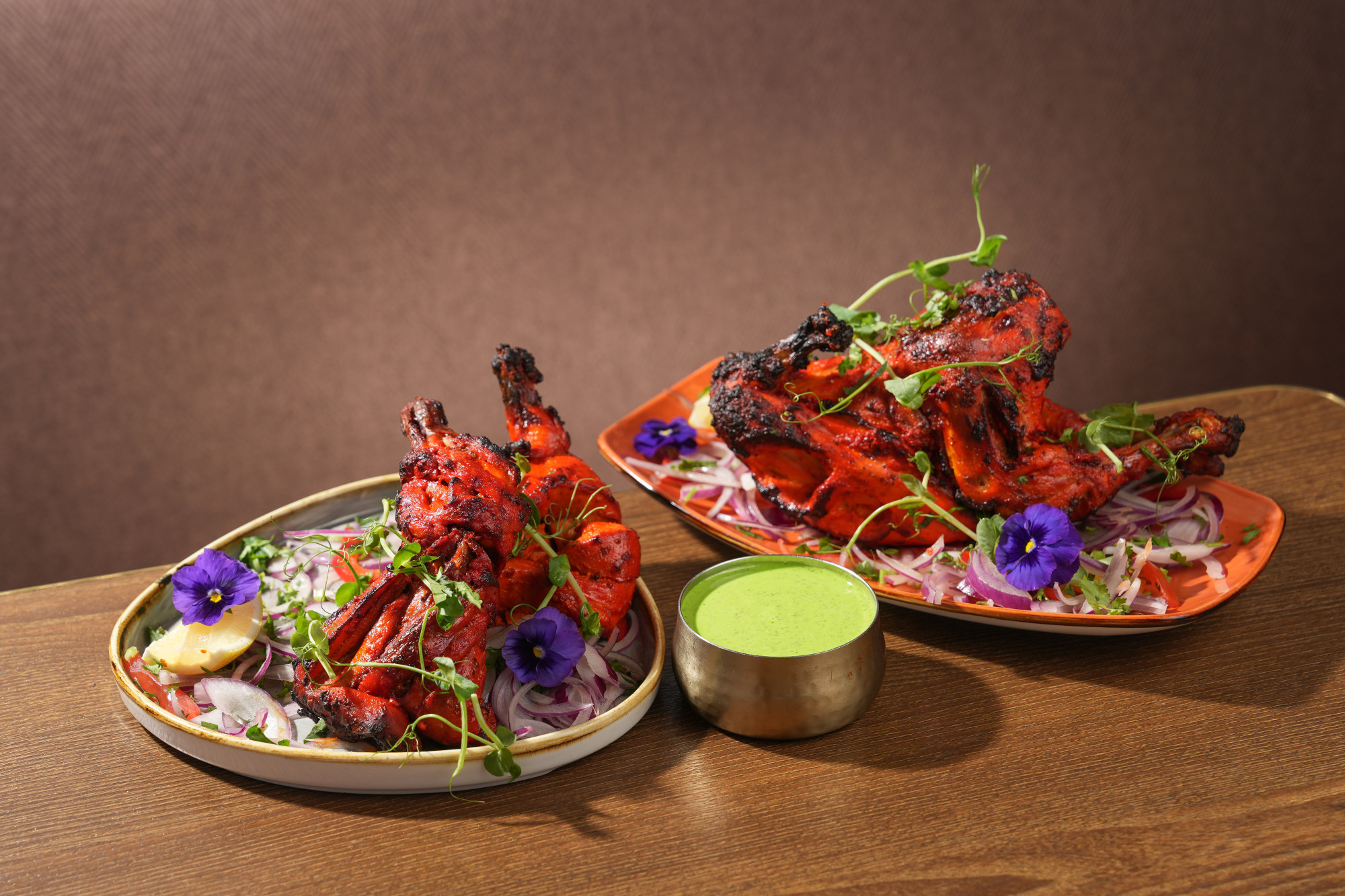 Indian restaurant Gaylord spotlights US poultry with its tandoor US Cornish hen in spiced yogurt. Photo: Gaylord