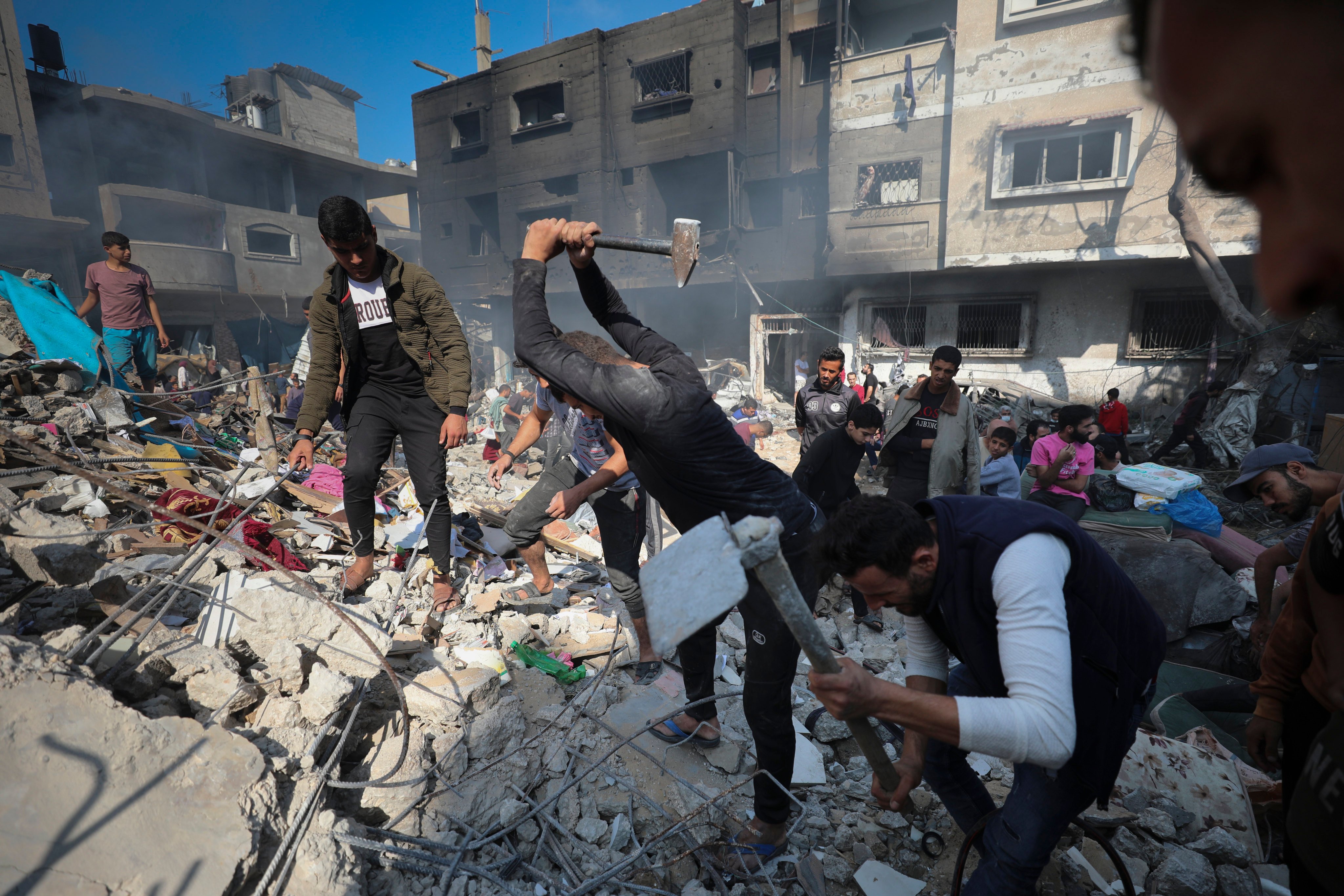 Palestinians search for survivors after an Israeli strike on Nusseirat refugee camp, in the central Gaza Strip on Friday. Photo: AP