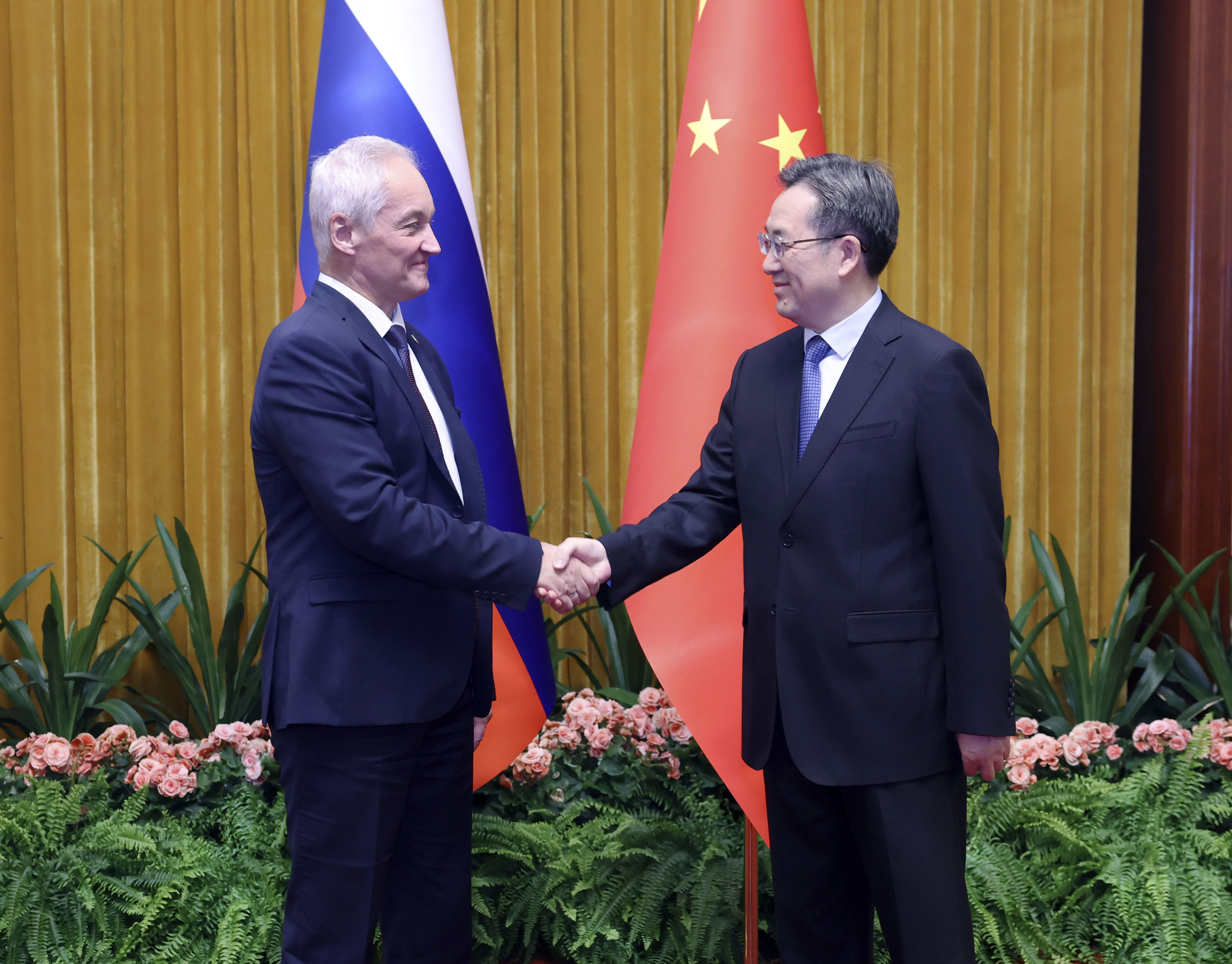 Chinese Vice-Premier Ding Xuexiang (right) shakes hands with Russian First Deputy Prime Minister Andrey Belousov at the 10th meeting of the China-Russia Investment Cooperation Committee in Beijing on Monday. Photo: Xinhua 