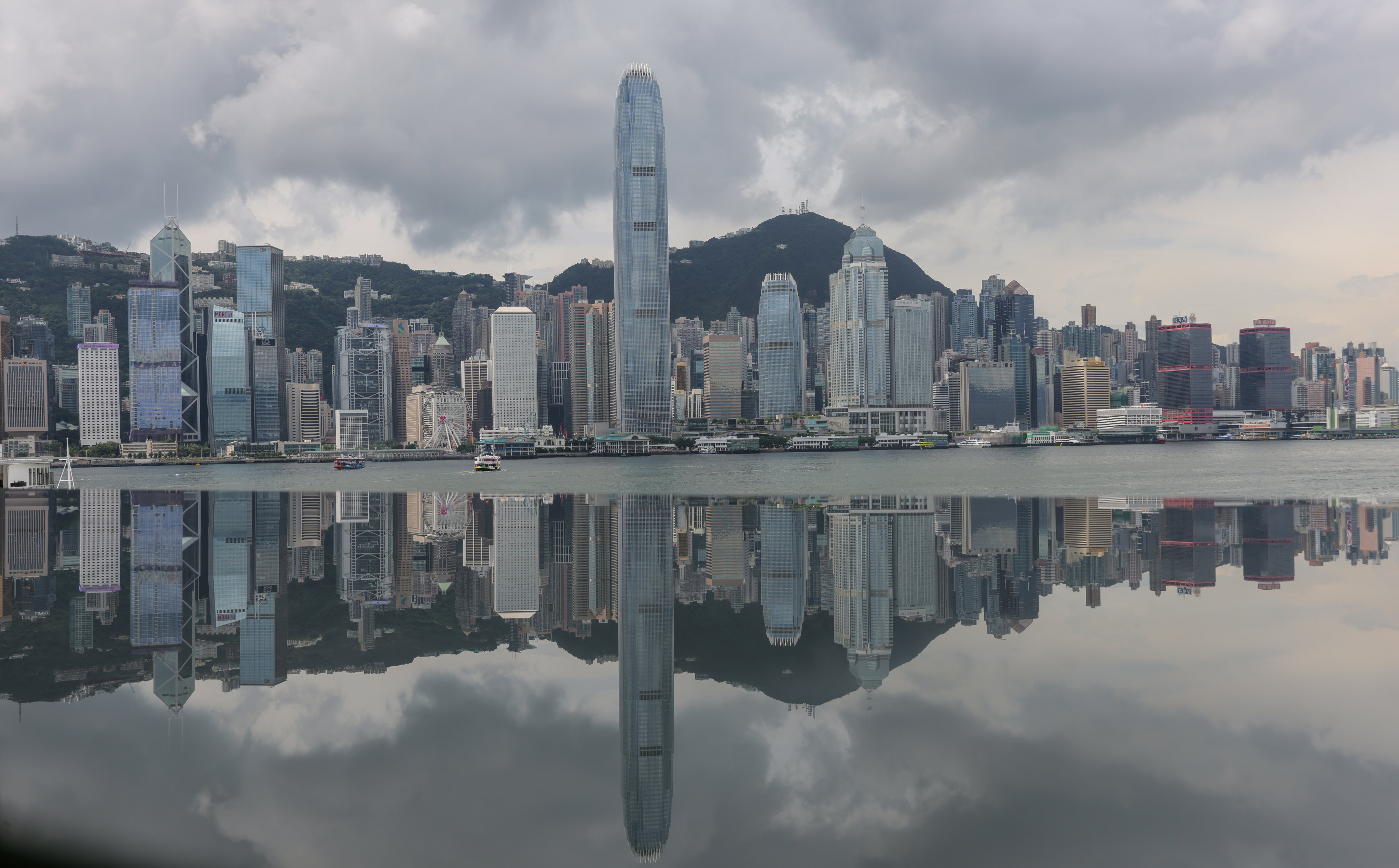 Hong Kong’s financial district, anchored by the International Finance Centre, reflects on Victoria Harbour on August 29, 2023. Photo: Jelly Tse