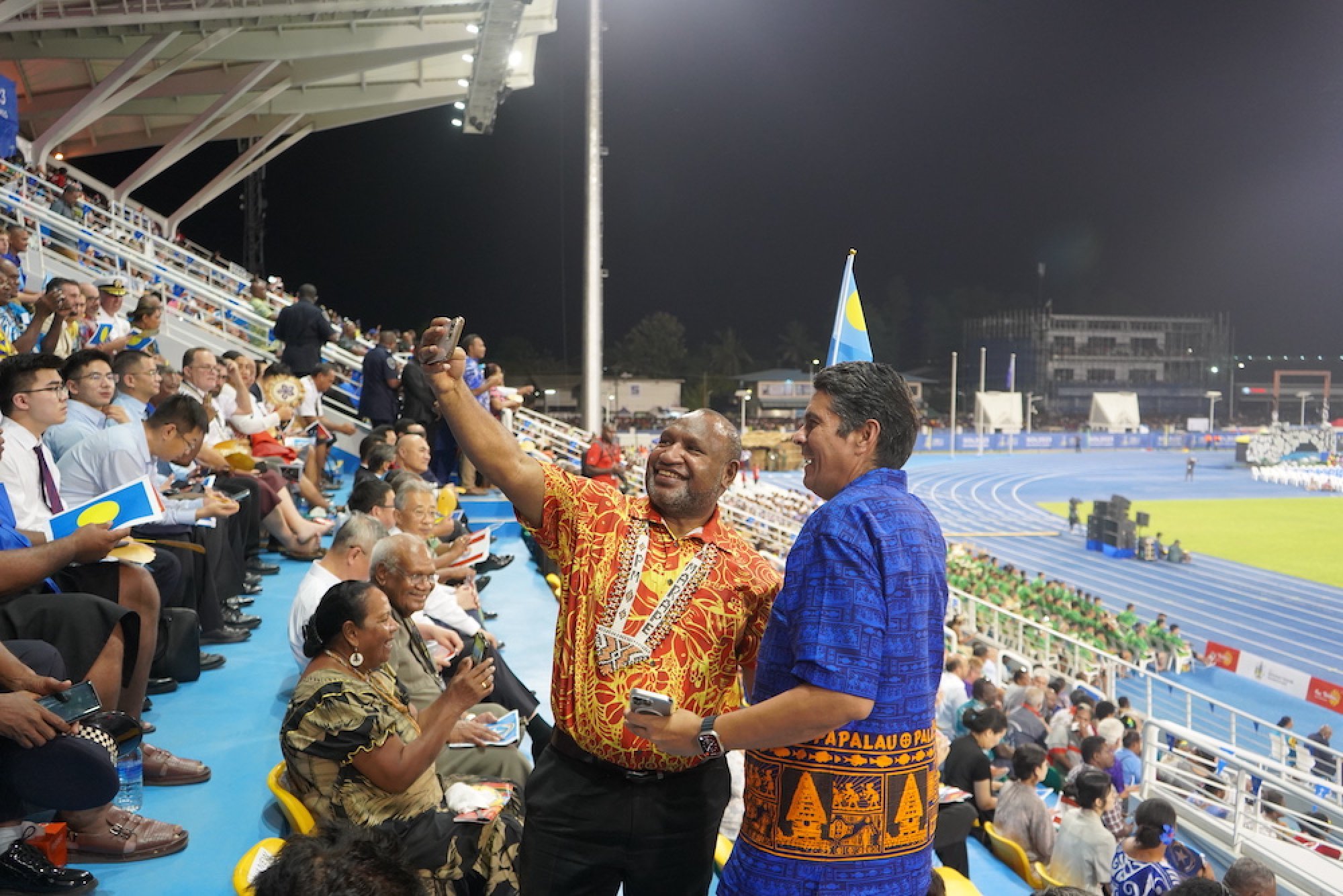 Papua New Guinea President James Marape (in red and yellow shirt) takes a selfie with Palau President Surangel Whipps Jnr in Honiara, Solomon Islands, for the Pacific Games, on Sunday. Photo: Christopher Cottrell