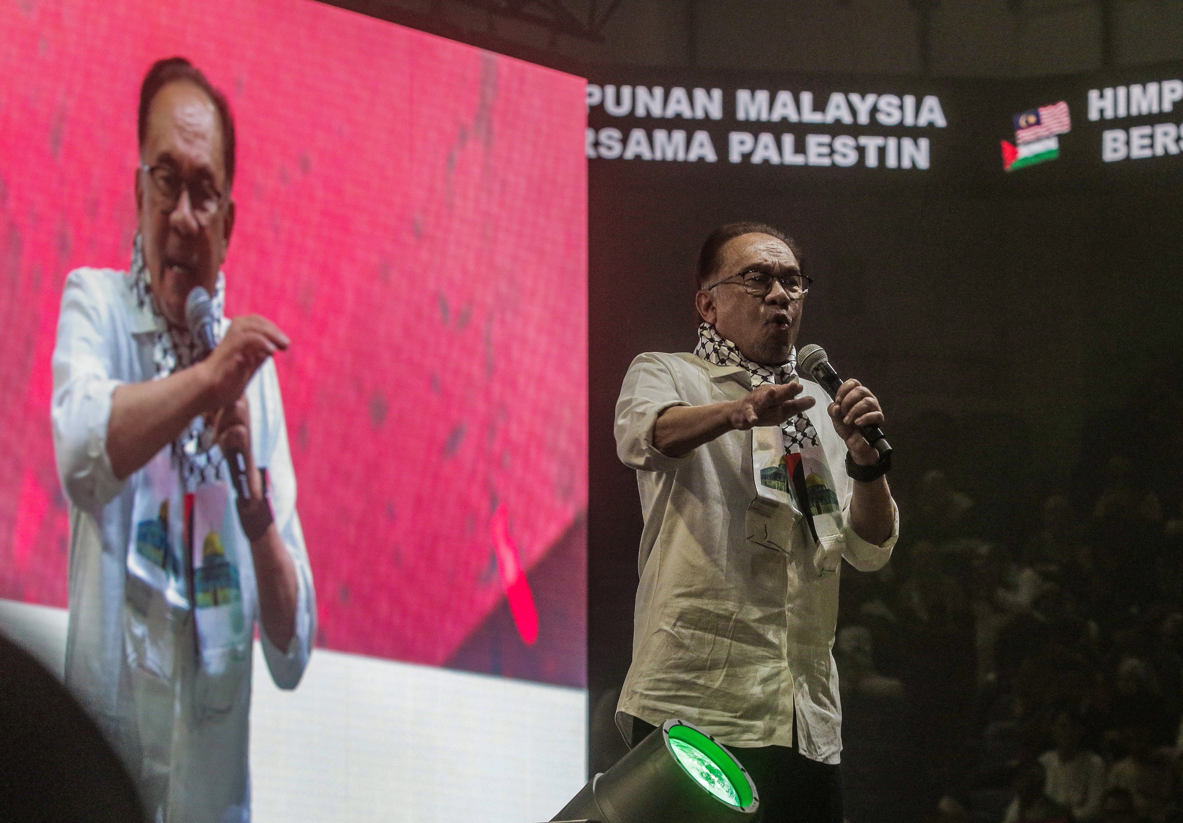 Malaysia’s Prime Minister Anwar Ibrahim speaks at the ‘Malaysia Stands with Palestine’ rally in Kuala Lumpur on October 24. Photo: EPA-EFE