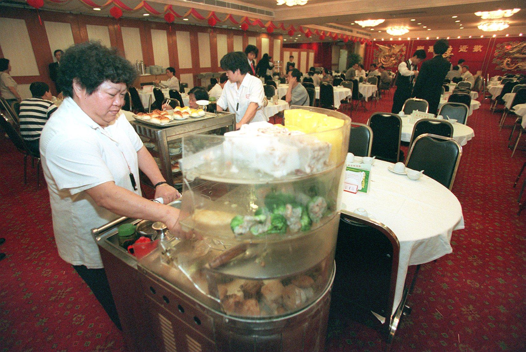 “Dim sum aunties” push trollies of food at the New Kwong Tung Seafood Restaurant in Tuen Mun, Hong Kong, in May 1997. Offering retro-themed dining events incorporating traditional dishes could form part of a “time travel” tourism concept that could boost visitors to the city. Photo: SCMP