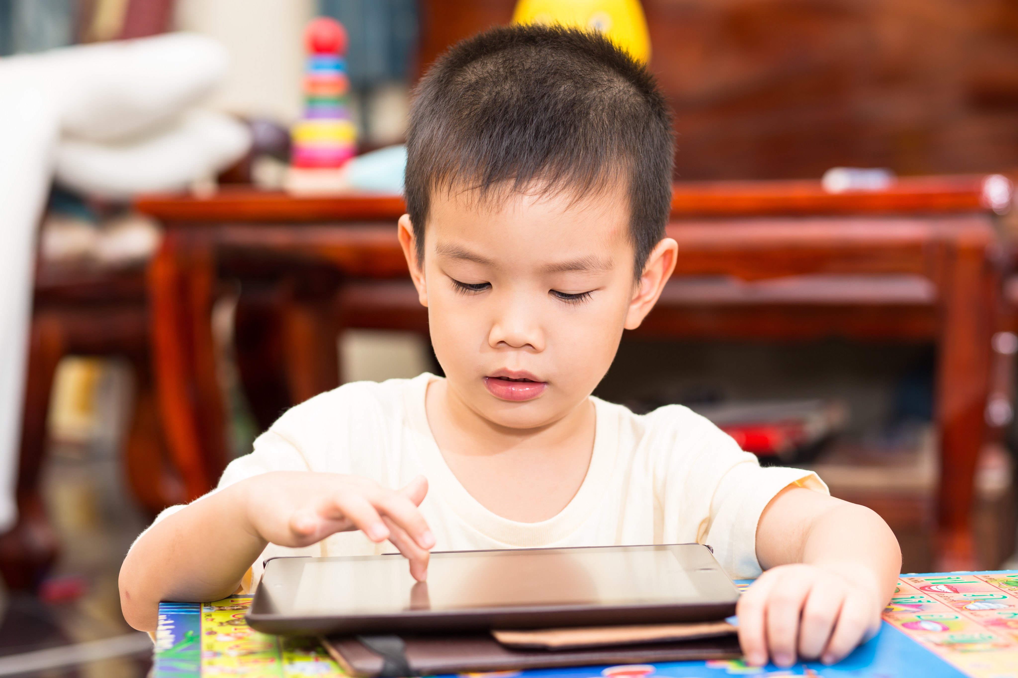 Gen Z are taking to TikTok to express their fears about raising kids who are hooked on iPads. The issue once applied to TV and video games, but whatever the device, too much screen time does affect early childhood development. Photo: Shutterstock