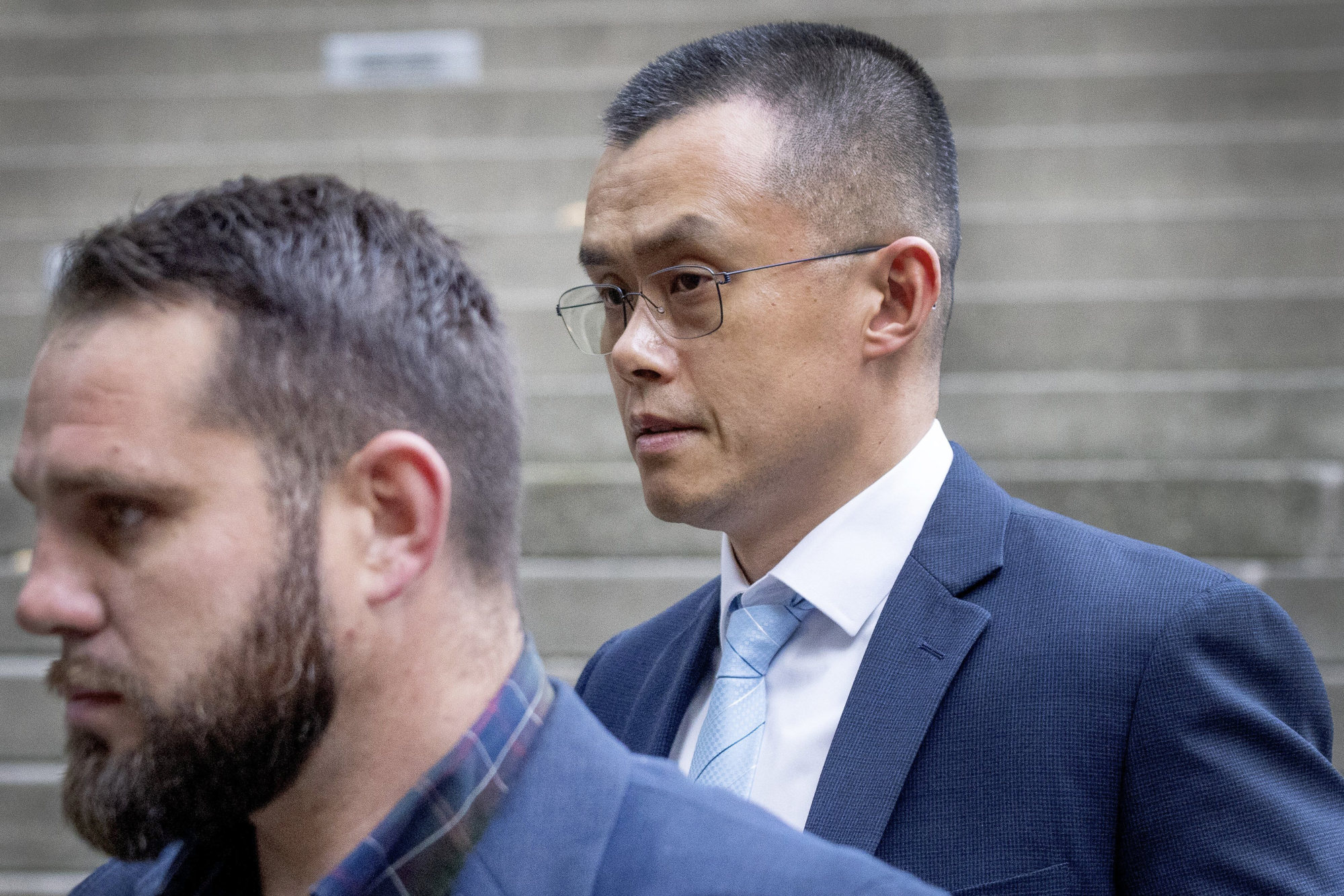 Binance CEO Changpeng Zhao, right, leaves federal court in Seattle, November 21, 2023, after pleading guilty to violations of US anti-money laundering laws. Photo: The Seattle Times via AP