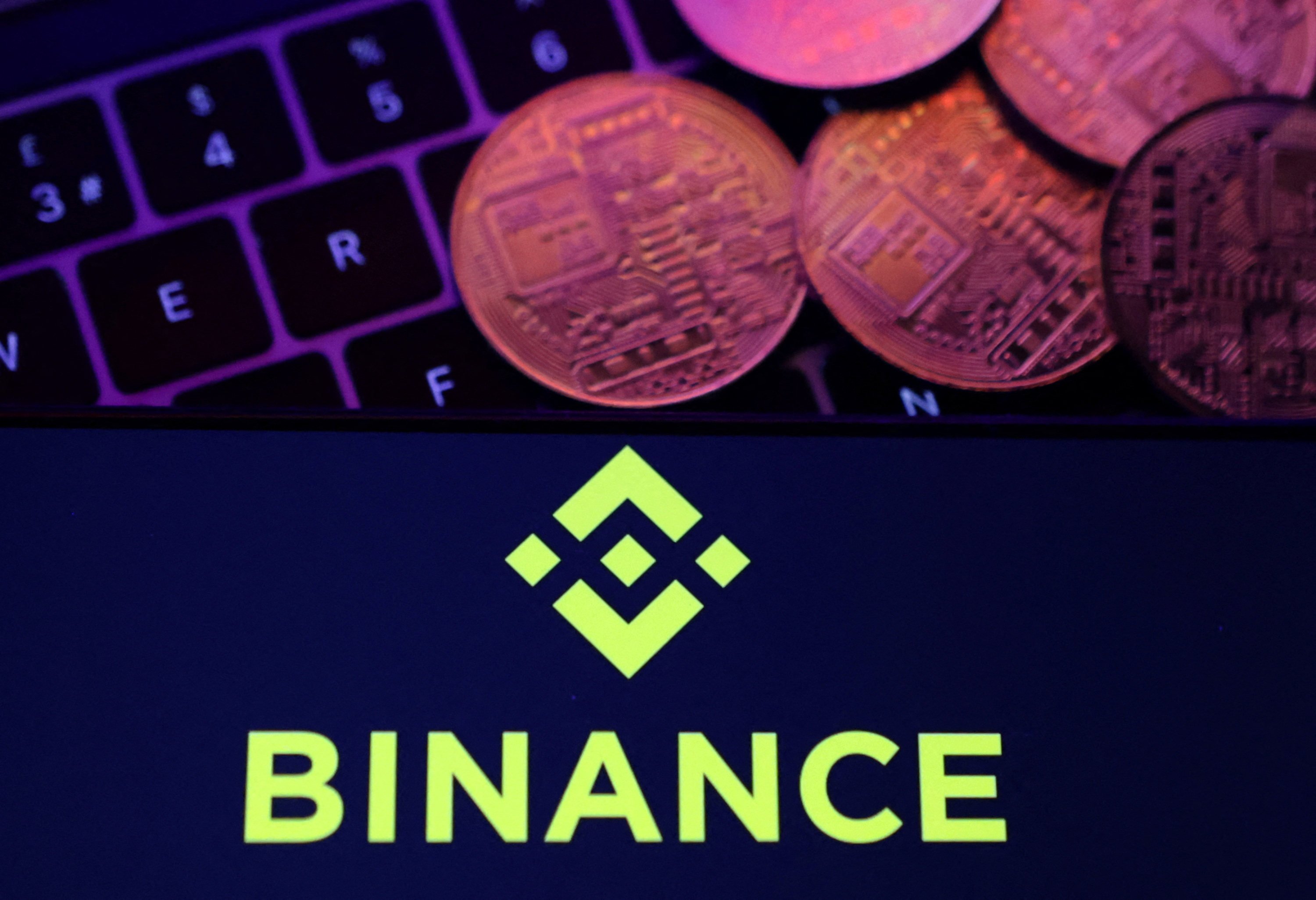 The Binance logo and a representation of cryptocurrencies are placed on a keyboard in this illustration, November 8, 2022. Photo: Reuters