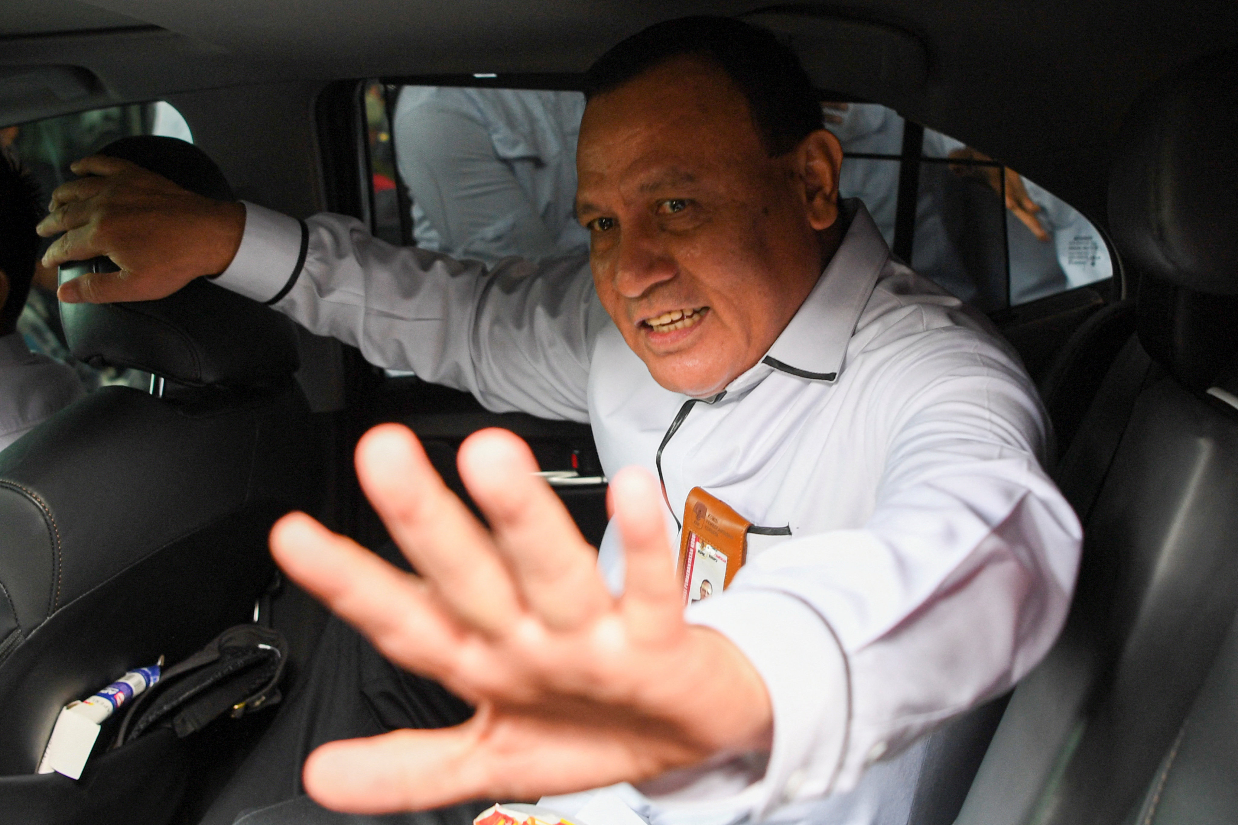 Firli Bahuri, chairman of the Corruption Eradication Commission, enters his car after responding to the summons at the KPK Anti-Corruption Education Center building in Jakarta. Photo: Reuters