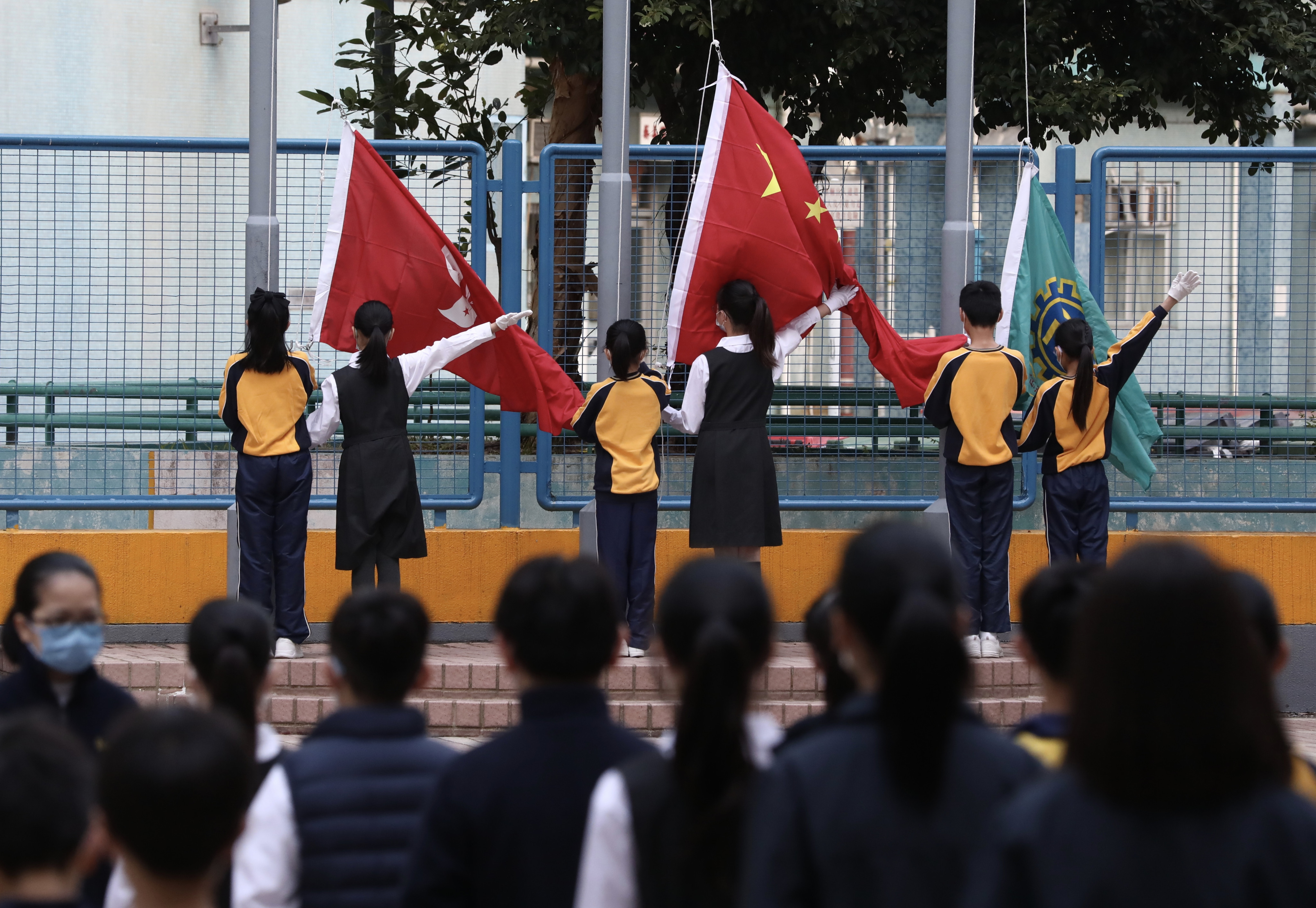 A flag raising ceremony at a primary school in Kwai Fong last year. The new humanities course was mentioned by city leader John Lee in his policy address last month. Photo: Jonathan Wong