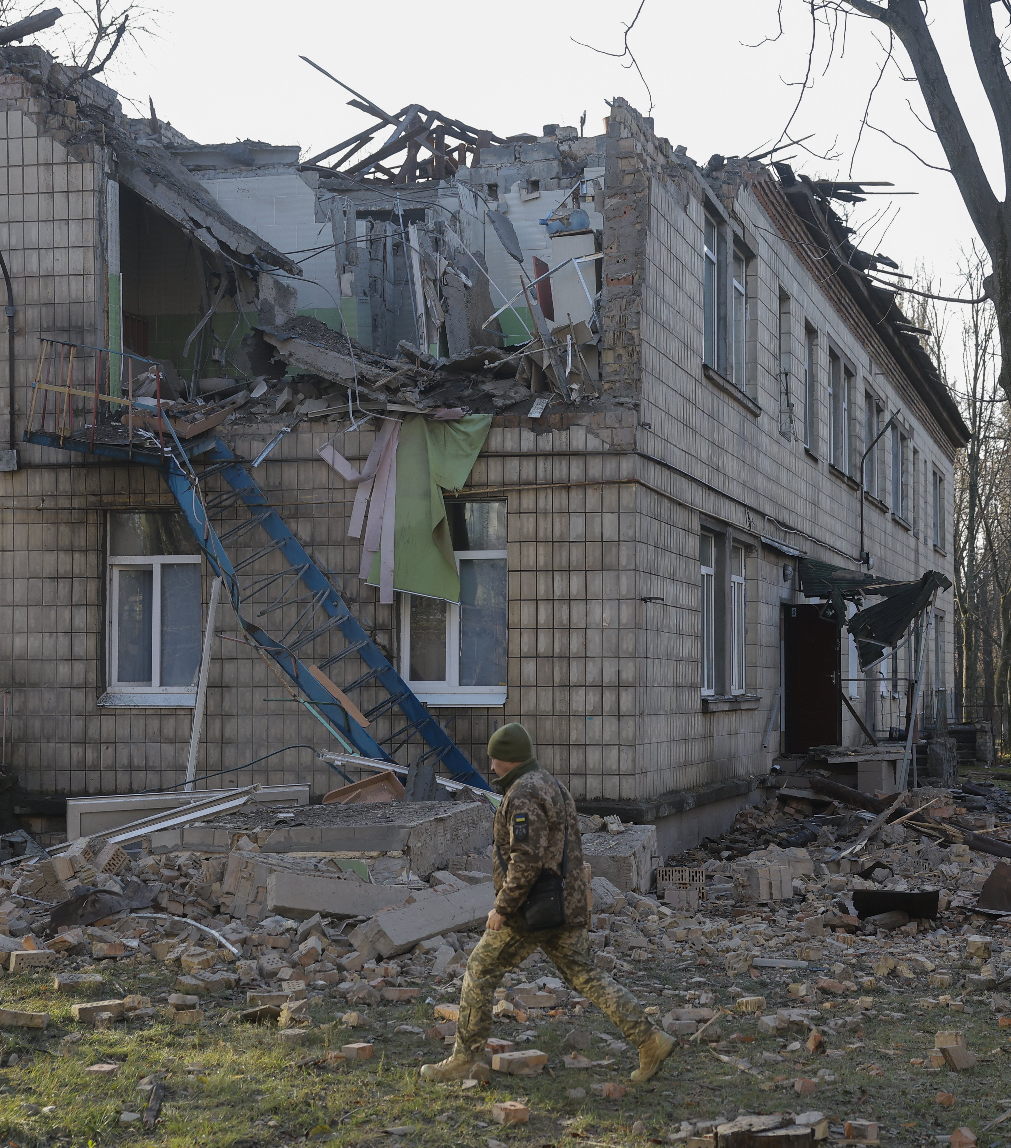 A police officer inspects a nursery school damaged during drone strikes in Kyiv on Saturday. Photo: EPA-EFE