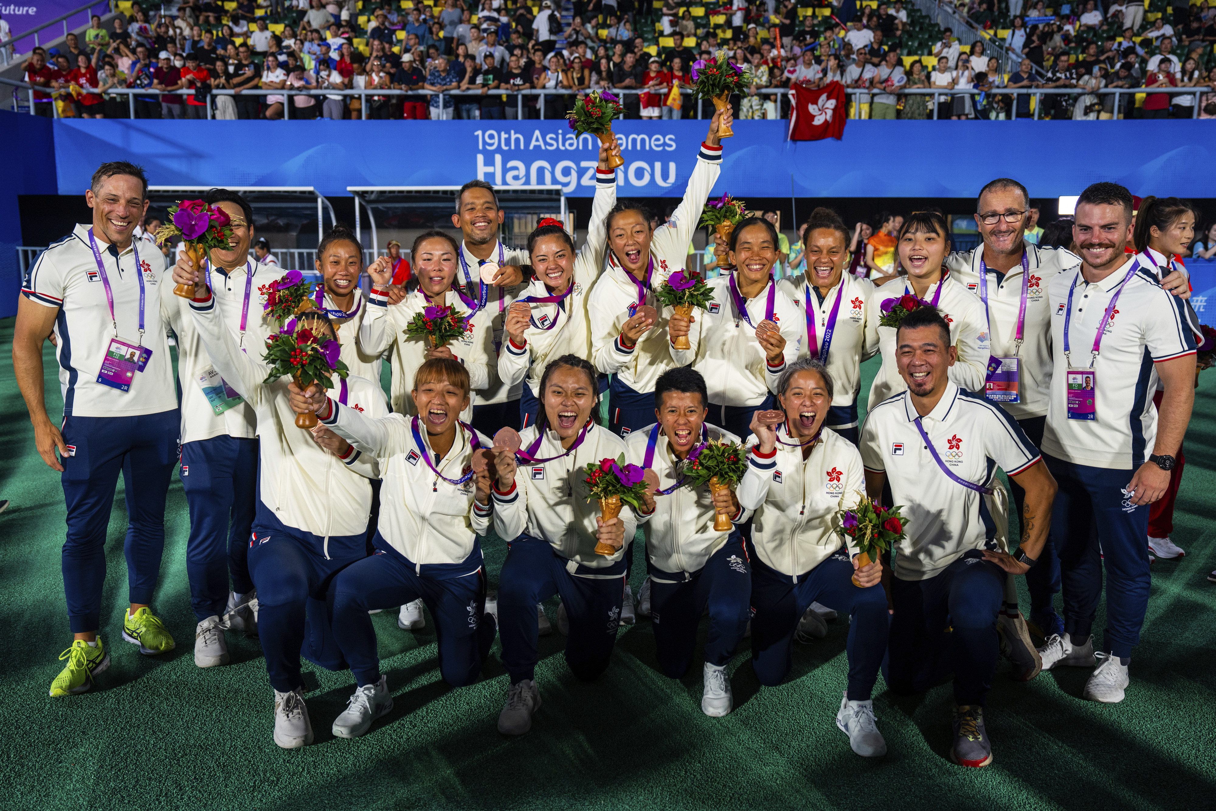 Hong Kong’s women’s sevens team celebrate with their bronze medals at the Asian Games in Hangzhou. Photo: AP