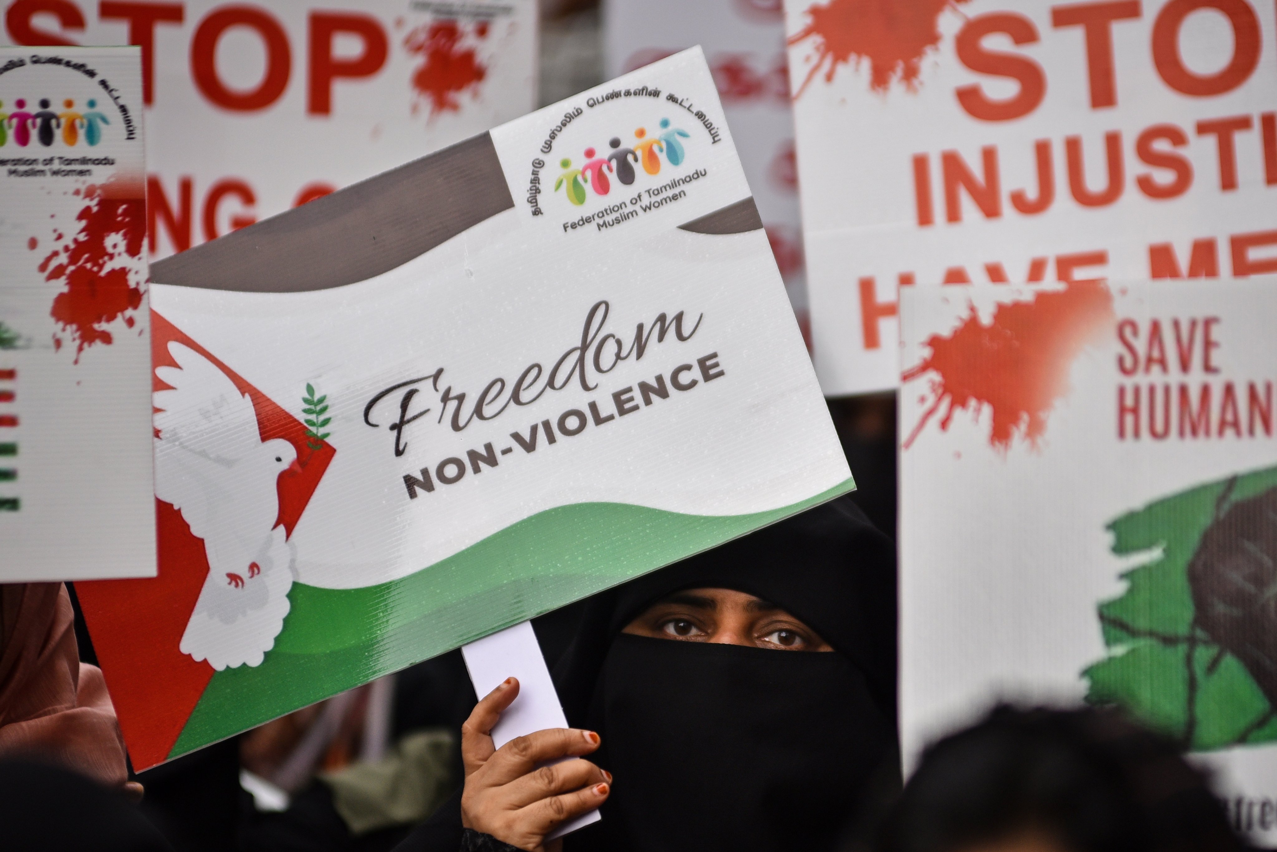 An Indian Muslim woman holds a placard as she takes part in a pro-Palestinian demonstration in Chennai last month amid the ongoing Israel-Gaza conflict. Photo: EPA-EFE