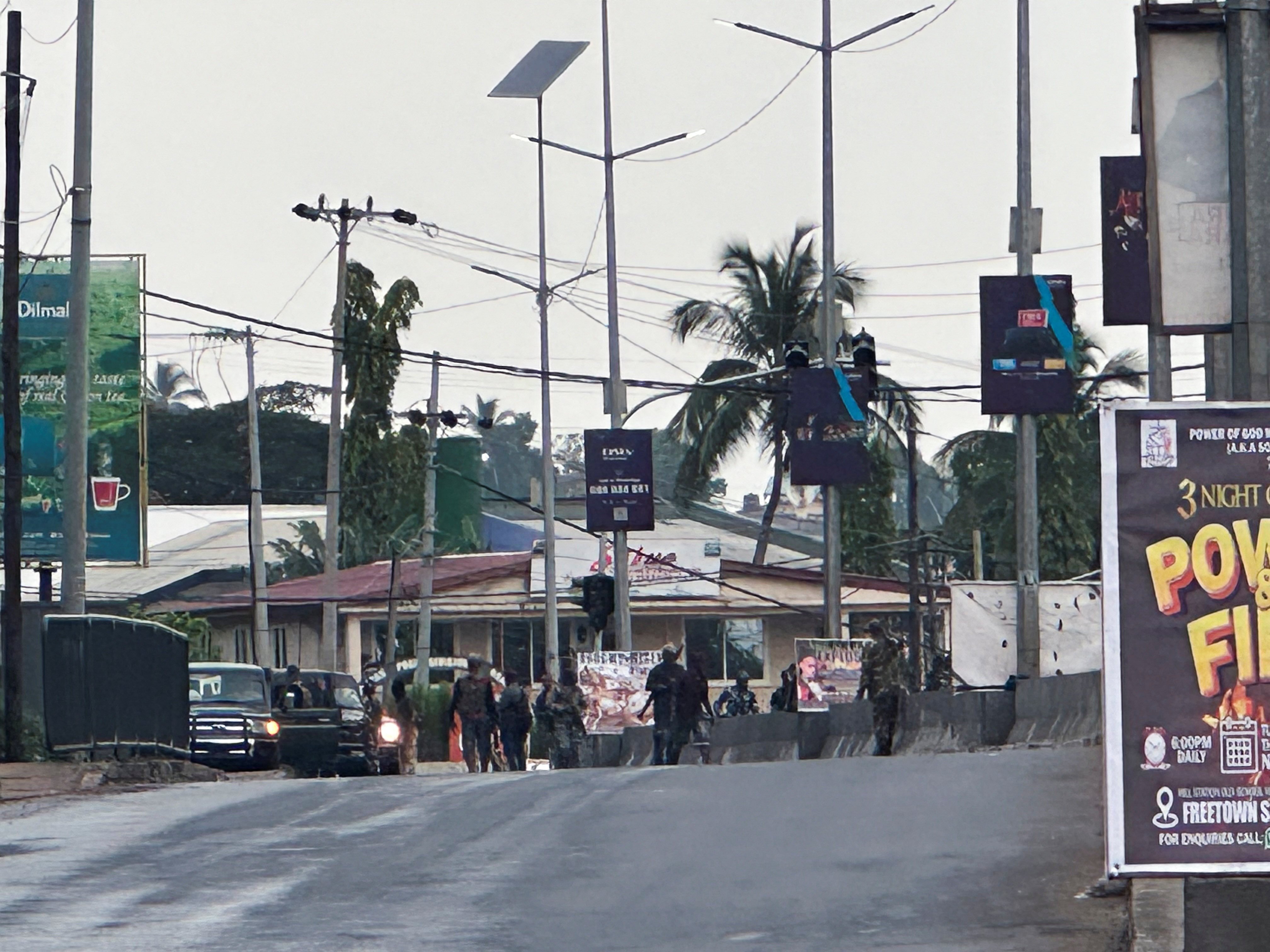 Hooded armed men in military fatigues in Freetown, Sierra Leone, after unidentified gunmen attacked a military barracks. Photo: Reuters
