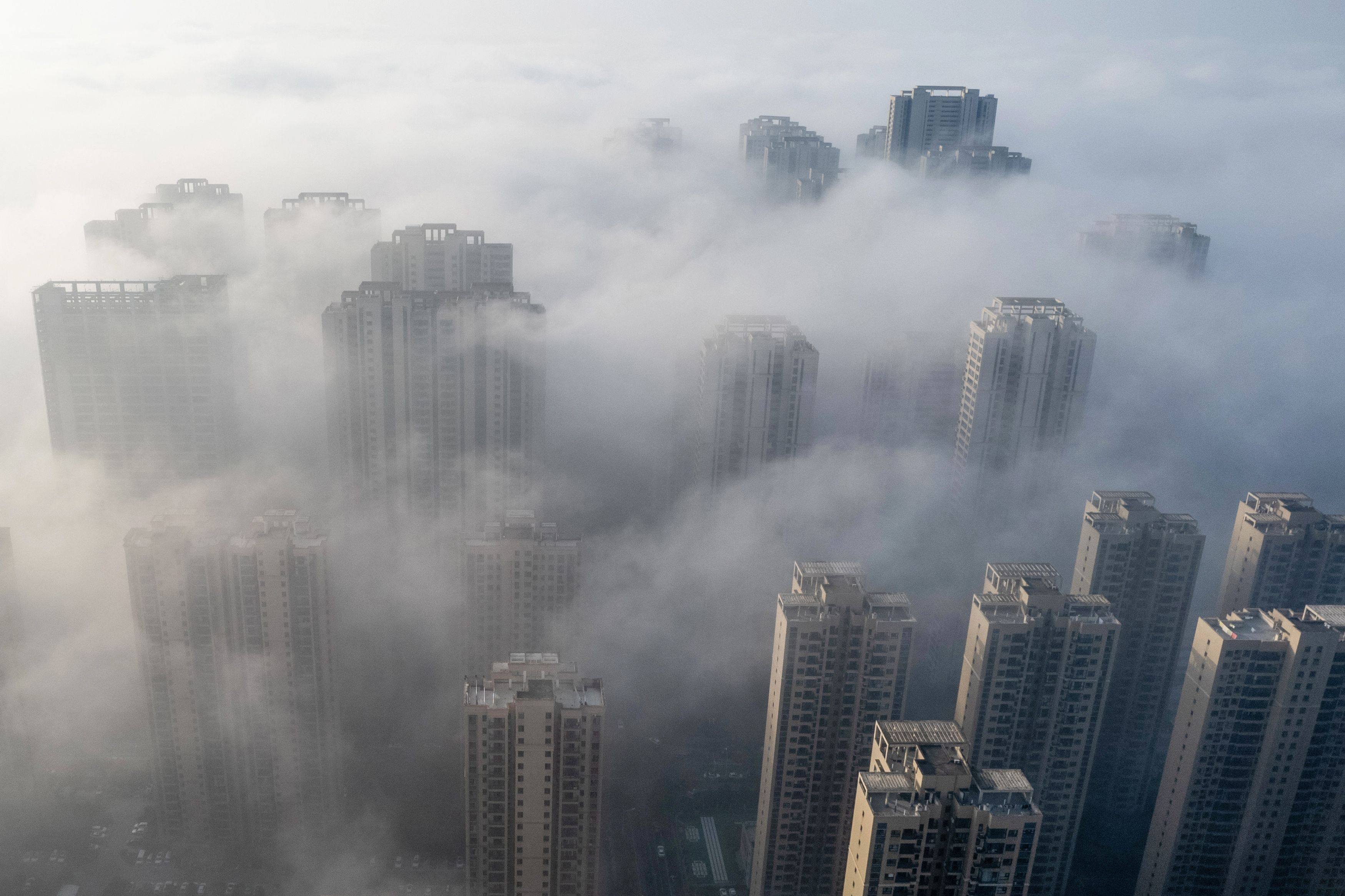 An aerial photo taken on November 27, 2023 shows fog over residential buildings in Wuhan, in China’s central Hubei province. Photo: AFP