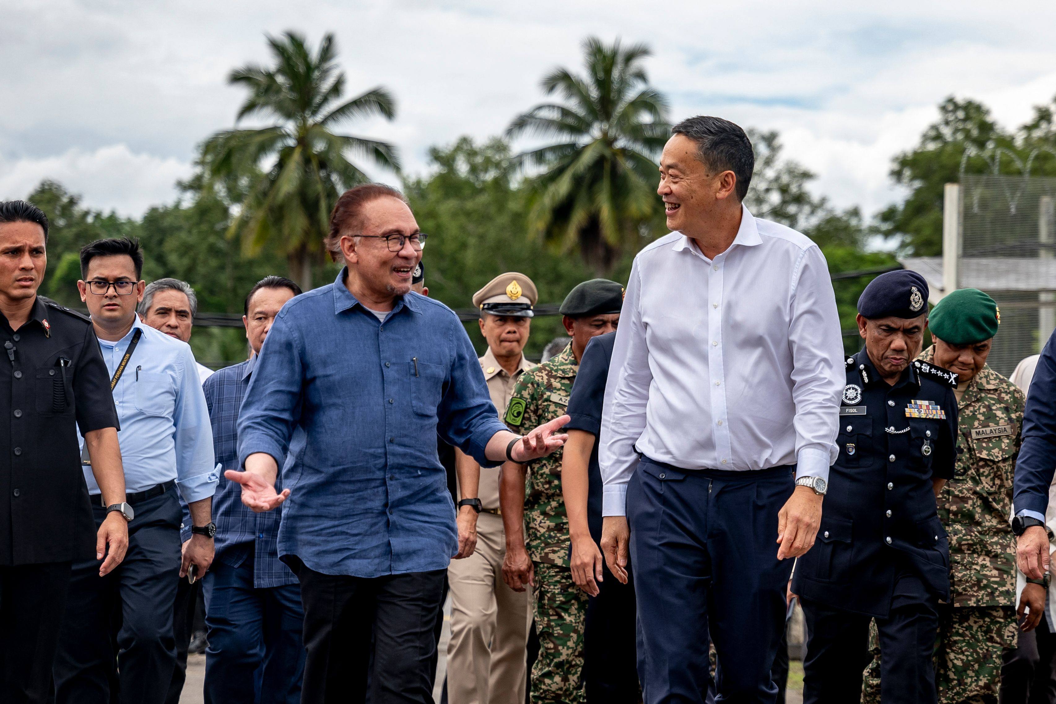 Malaysian Prime Minister Anwar Ibrahim (left) walks with his Thai counterpart Srettha Thavisin during their meeting on Monday in Thailand’s Sadao near the Malaysia-Thailand border. Photo: Prime Minister’s Office of Malaysia/AFP