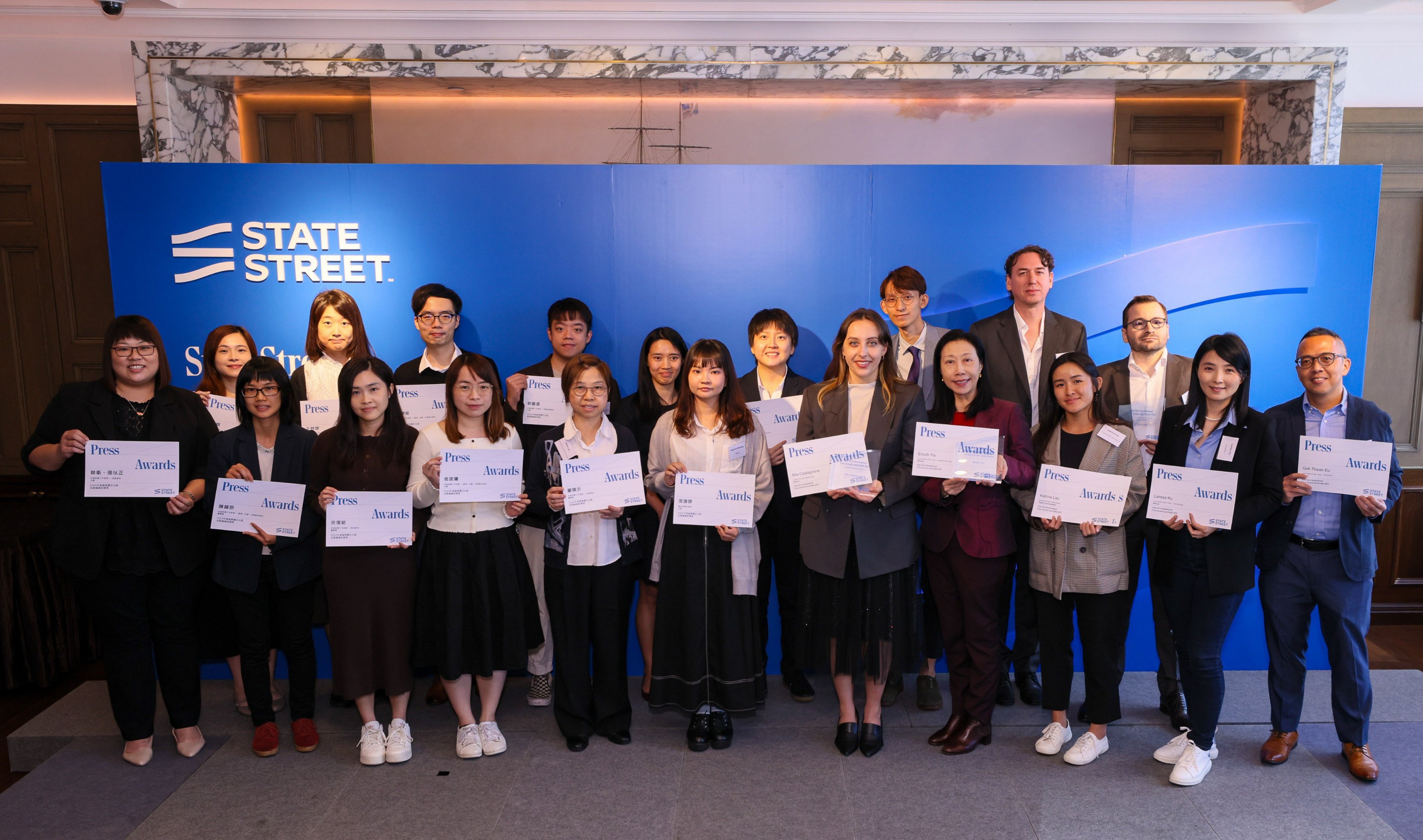 SCMP’s journalists Enoch Yiu (fourth right, front) and Mia Castagnone (fifth right, front) with their winners’ certificates at State Street Corporation’s 2023 Asia-Pacific Institutional Press Awards at the American Club on November 28, 2023. Photo: State Street