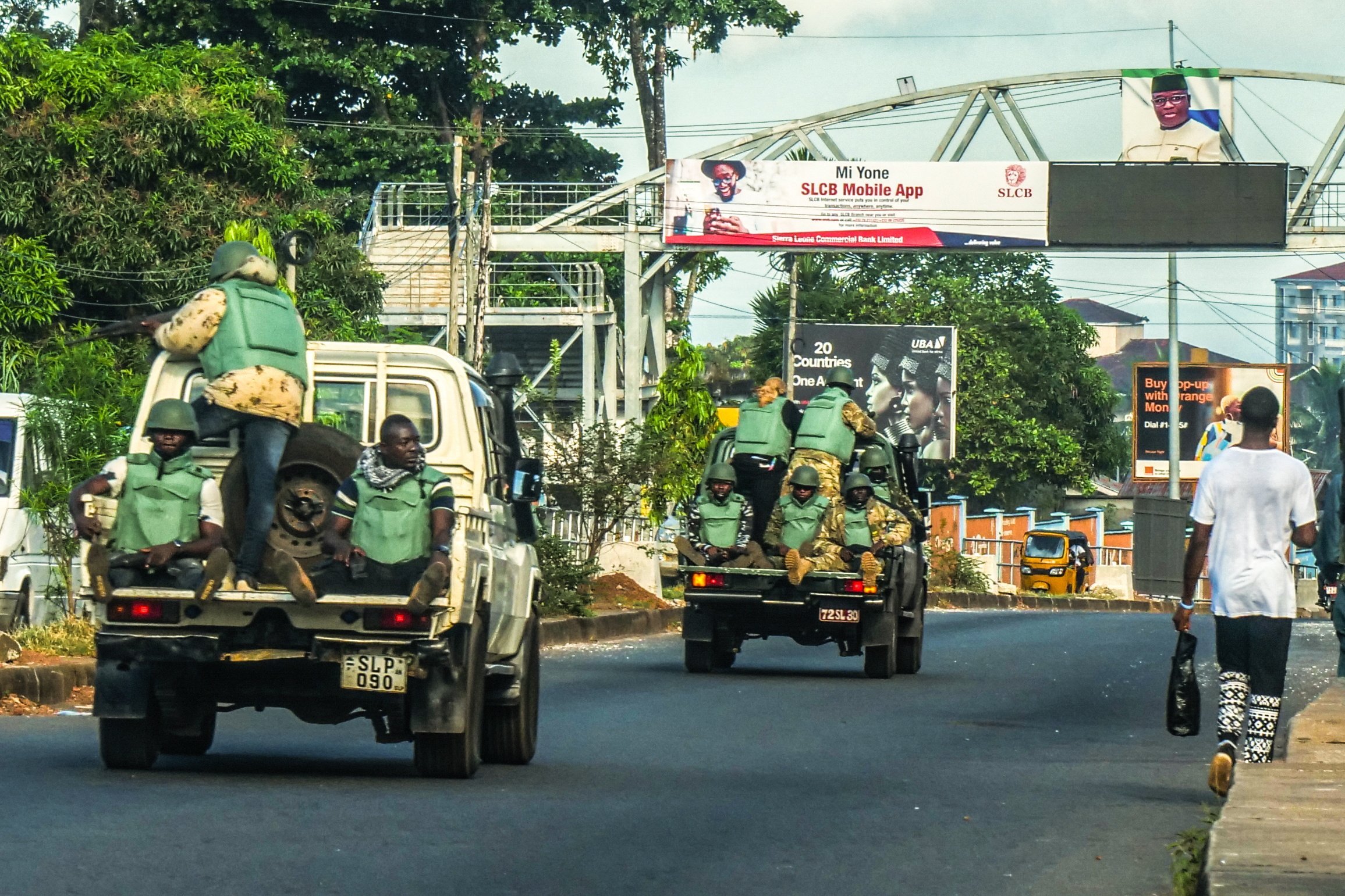 Soldiers riding in the back of army pickups in Freetown, Sierra Leone, on Monday. Photo: EPA-EFE