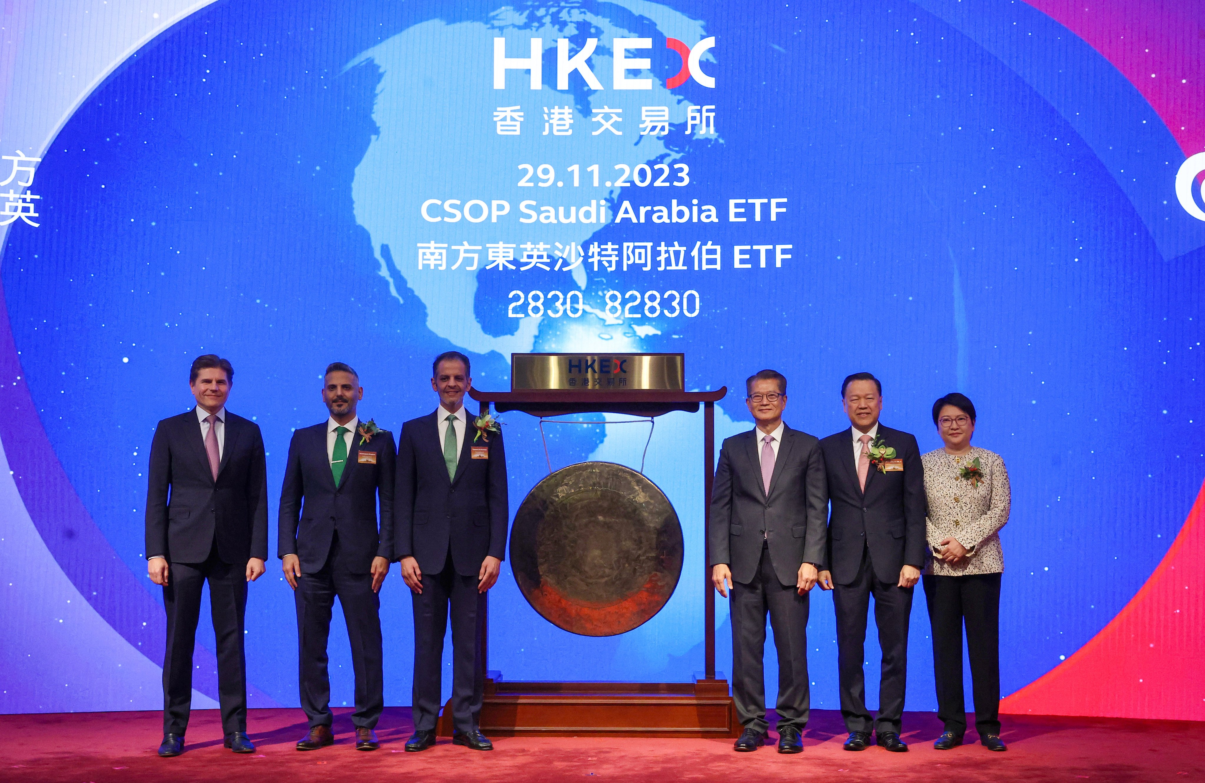 (From left) Nicolas Aguzin, CEO of HKEX; Abdulmajeed Alhagbani, head of securities investments at PIF; Yazeed Al-Humied, the deputy governor of PIF; Financial Secretary  Paul Chan; SFC chairman Lui Tim Leung and CSOP CEO Ding Chen attend the listing ceremony of the CSOP Saudi Arabia ETF on Wednesday. Photo: Edmond So