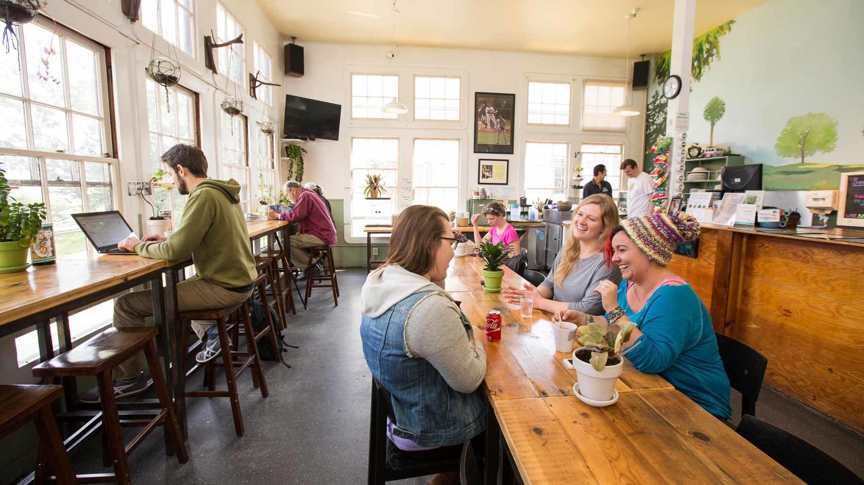 Travellers enjoy the cafe at HI San Francisco Fisherman’s Wharf Hostel, where a private room costs less than US$100 on some nights and the rate includes Wi-fi, breakfast and luggage storage. More travellers are considering hostels as alternatives to hotels and Airbnbs.