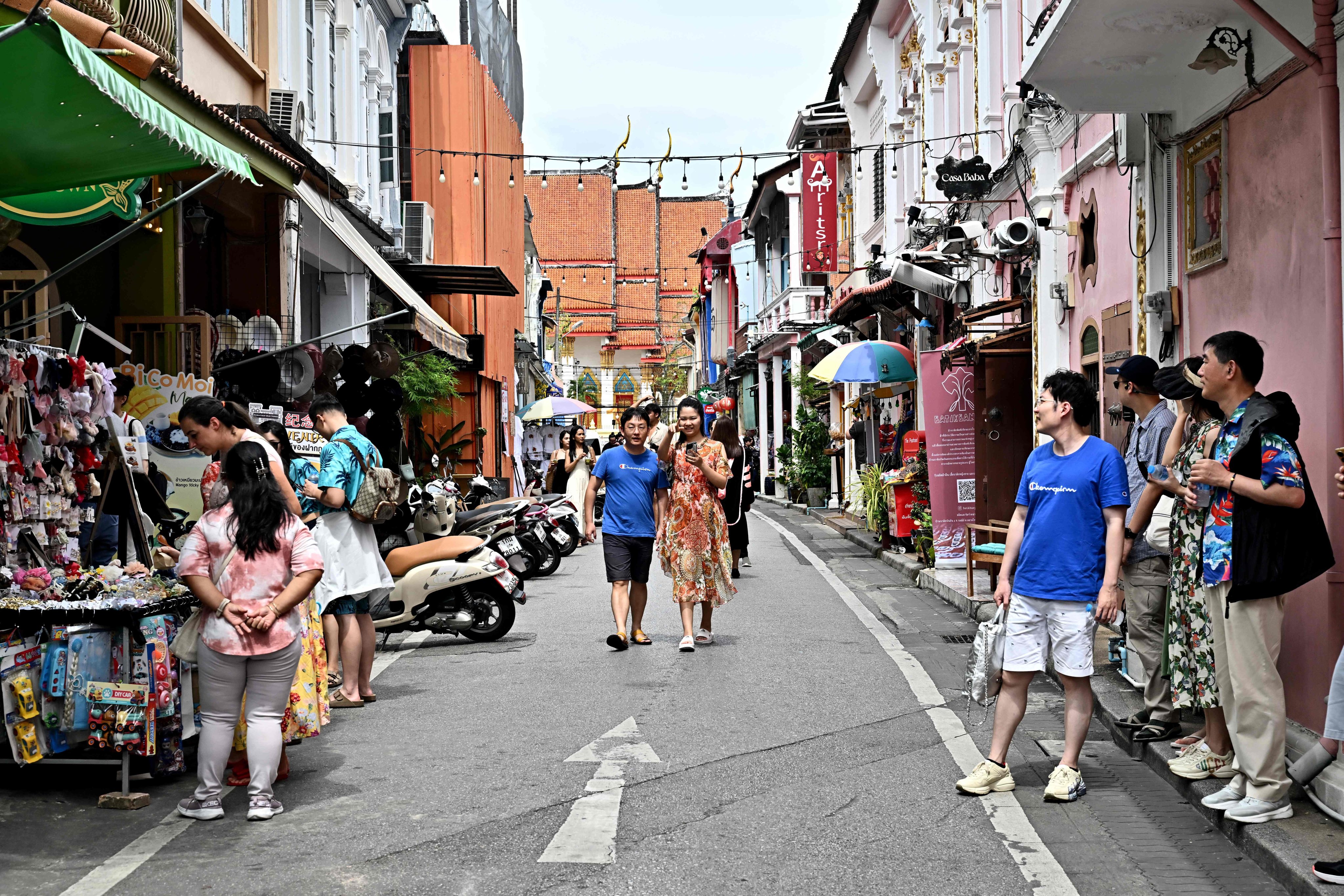 This photo taken on November 18, 2023 shows visitors walking in the Old Town in the southern Thai island of Phuket. Photo:AFP