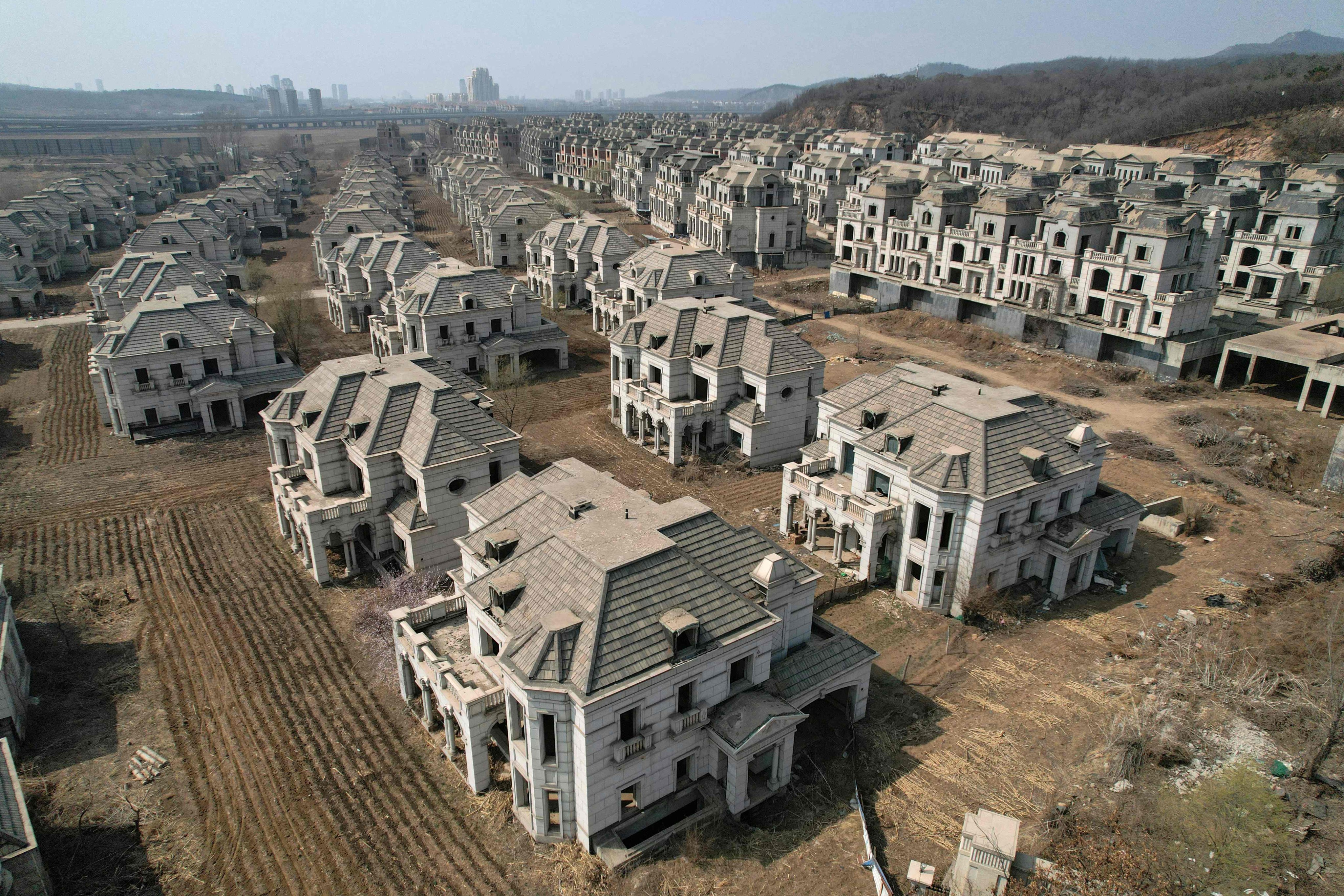 Deserted villas in a suburb of Shenyang, Liaoning province, are seen on March 31. The woes of China’s property sector have weighed heavily on the country’s economy and soured investor sentiment, but the strength of the economy’s fundamentals mean some are still projecting robust growth for 2024. Photo: AFP