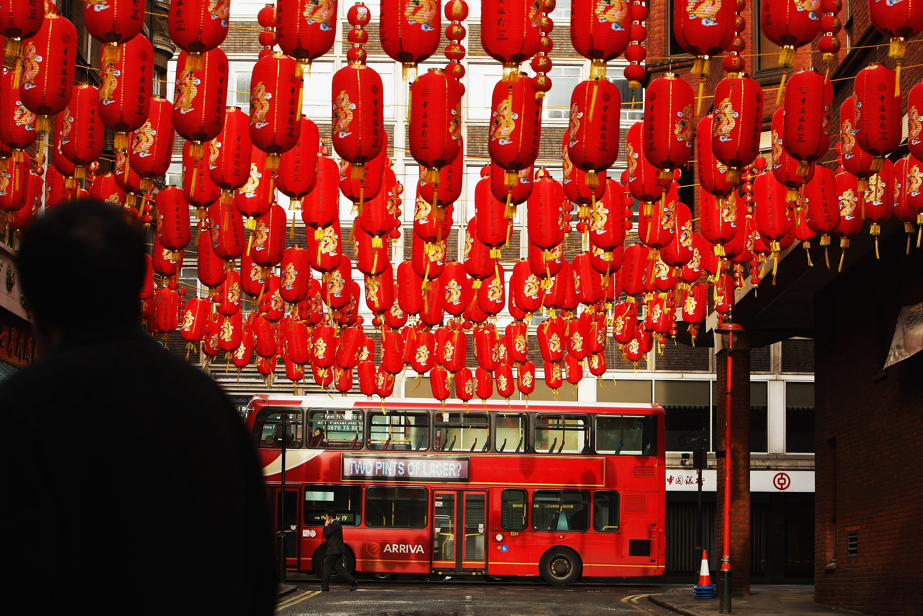A bus passes the entrance to Chinatown in London. Although Hongkongers tend to travel frequently, a few trips overseas as a tourist are not the same as being a resident. Photo: Getty Images