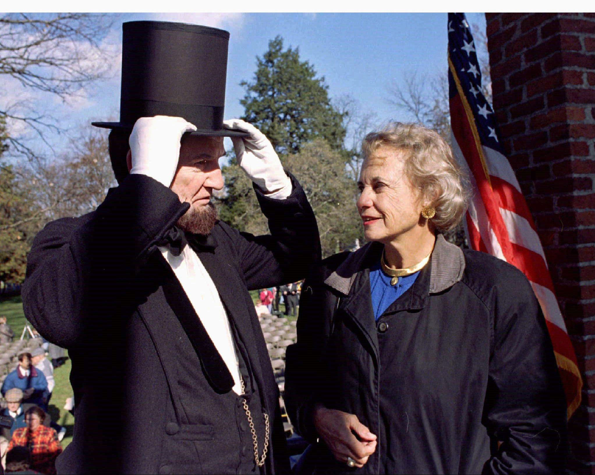 Supreme Court Justice Sandra Day O’Connor looks on as James A. Getty portrays President Abraham Lincoln at a ceremony at Gettysburg National Cemetery in 1996. Photo: Reuters