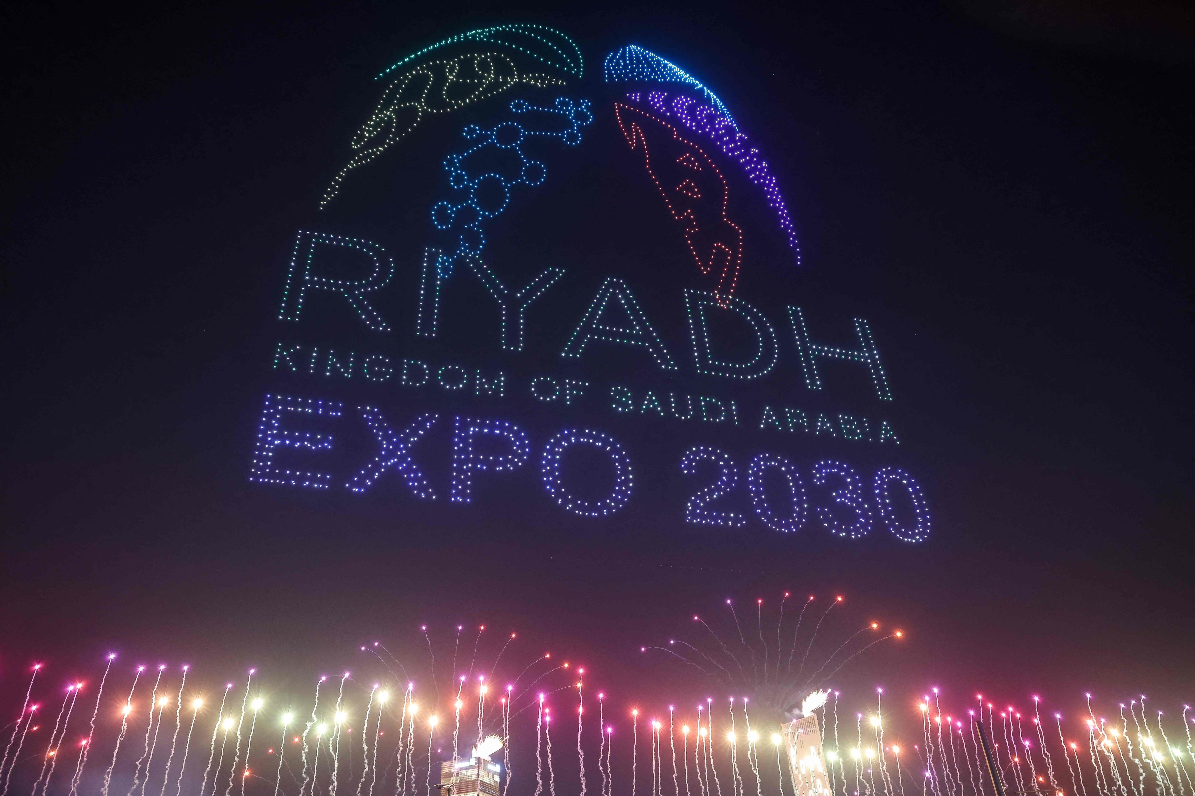 A light display created using drones is performed after Riyadh won the right to host the 2030 World Expo at King Abdullah Financial District in Riyadh, on November 28. Photo: AFP