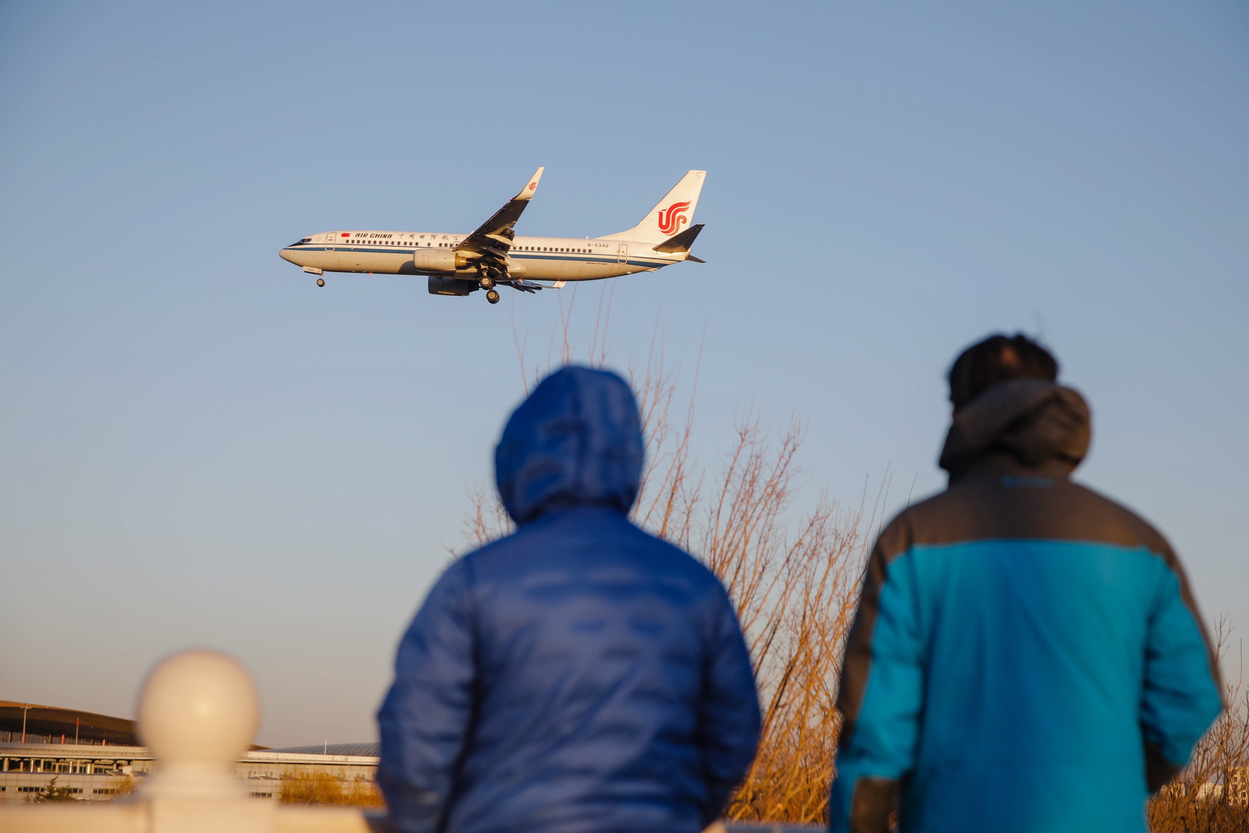 A passenger plane lands at Beijing Capital International Airport in December 2022. Photo: EPA-EFE