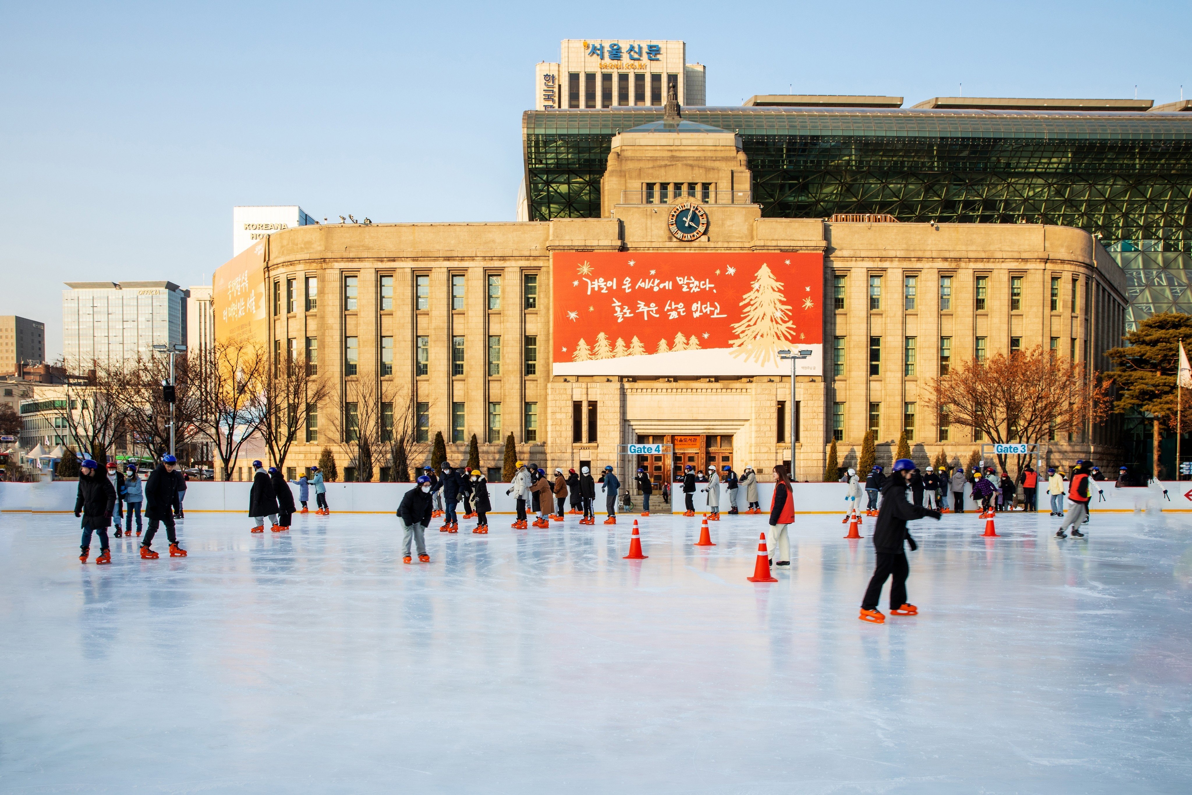 People ice skate at the Seoul Plaza Ice Skating Rink in Jung-gu, Seoul, South Korea, on January 5, 2023. The rink is among the best you can find in Seoul during the winter months. Photo: Shutterstock