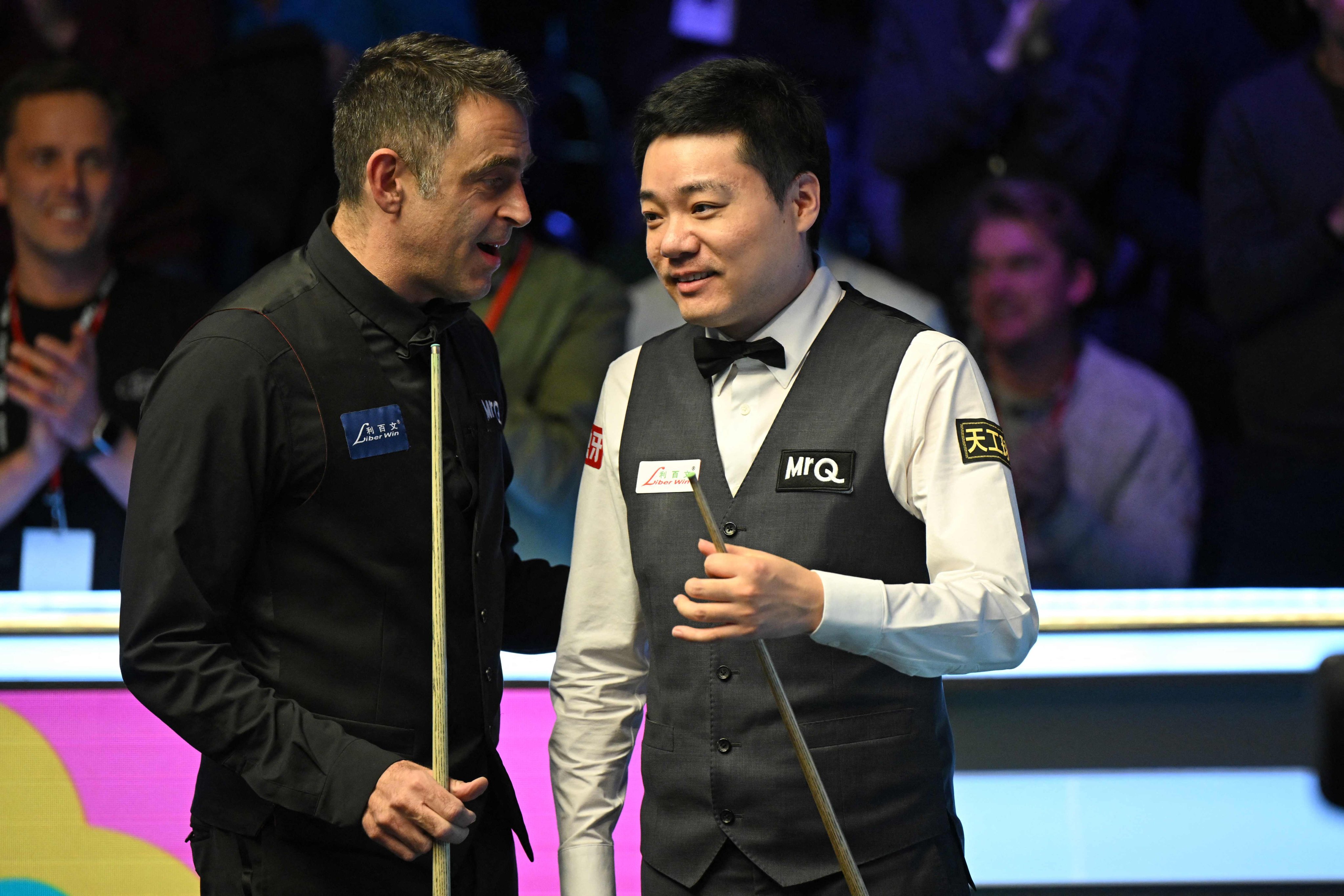 Ronnie O’Sullivan (left) consoles Ding Junhui after beating him in the UK final in York. Photo: AFP