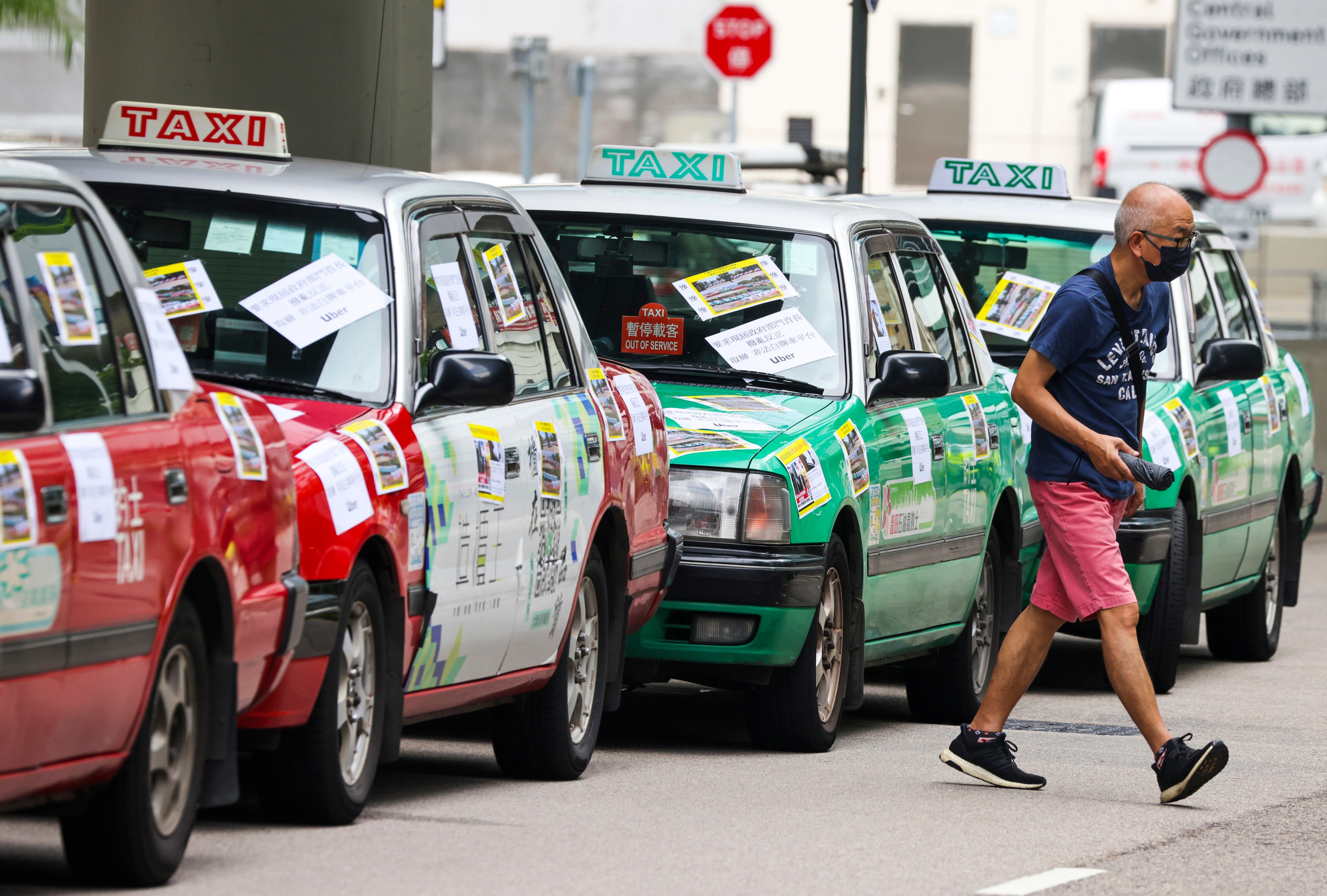 Taxi drivers protest outside Hong Kong government offices in 2022 urging a crack down on unlicensed car-hiring businesses and illegal online ride-hailing platforms such as Uber. Photo: Nora Tam